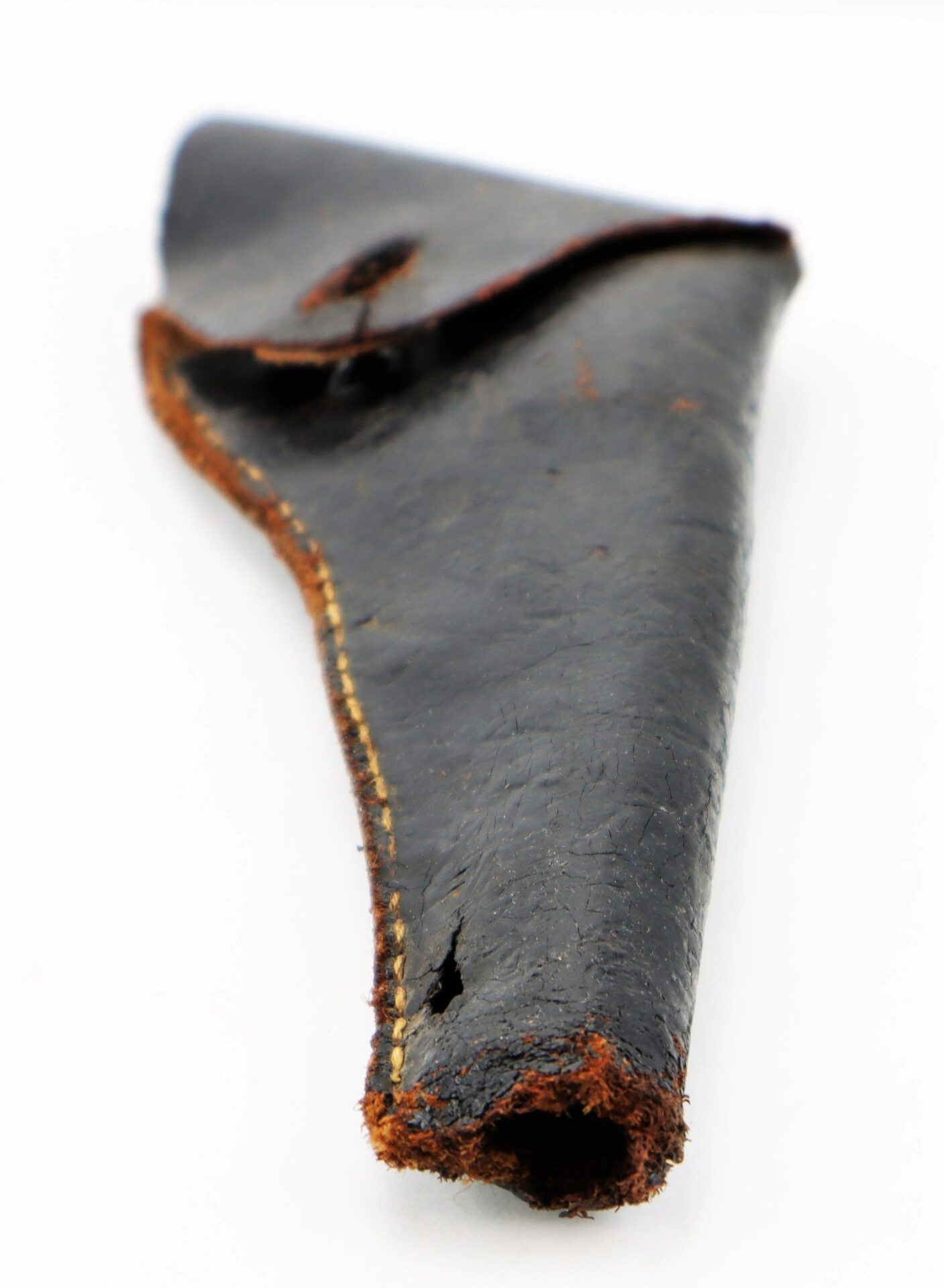 A worn Confederate Holster made of black leather with visible stitching and frayed edges, displayed on a white background.