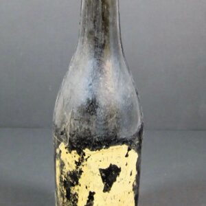 A 19th Century Beer Bottle - Non Excavated in dark glass with worn black and yellow paint and the number "13" on the front, shown against a plain background.