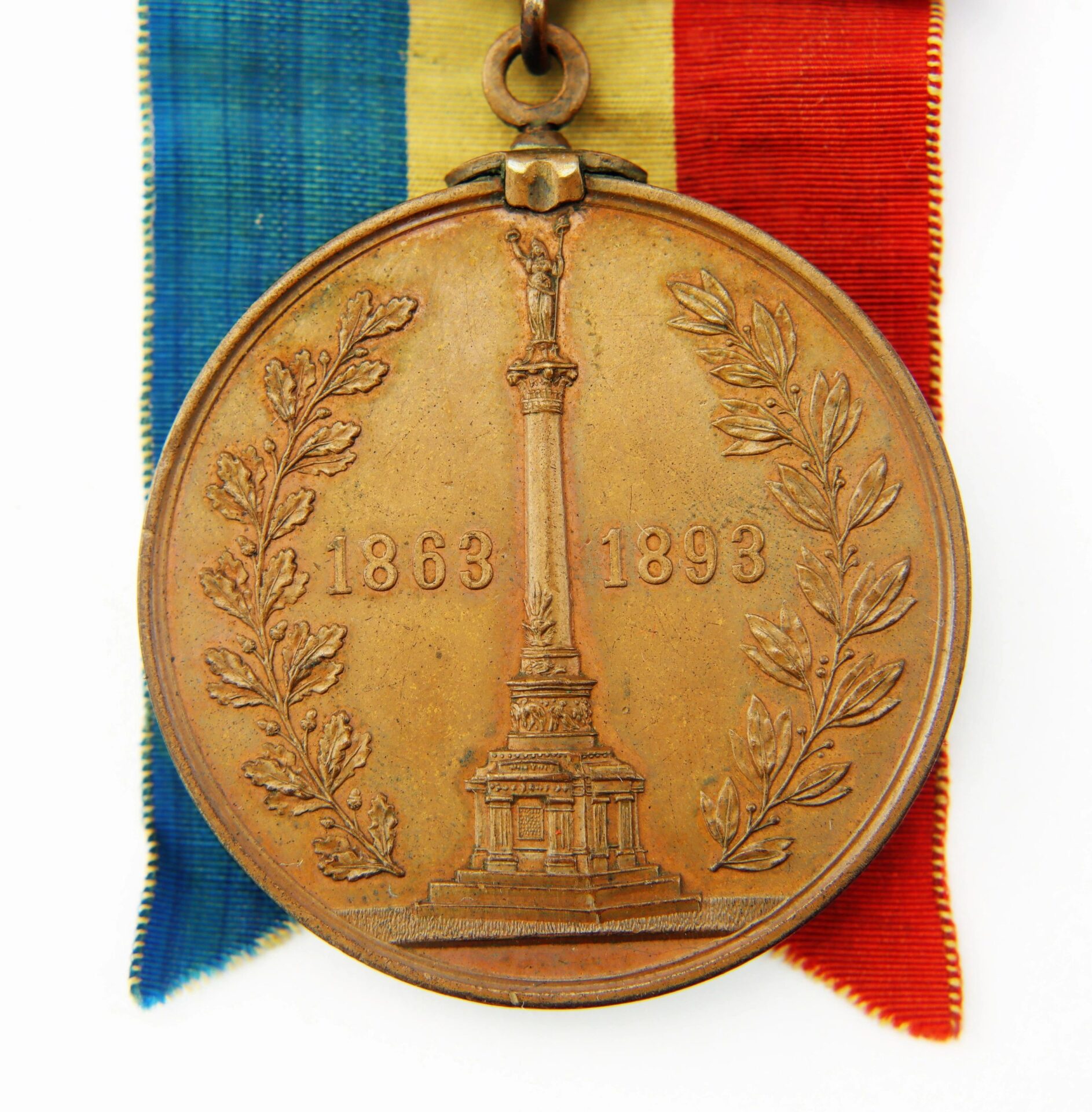 The Gettysburg New York Day Medal, inscribed to Private Hugh McDonald of the 40th NY Infantry “Mozart Regiment,” features a bronze medal with a monument, laurel branches, the years 1863 and 1893, on a ribbon of blue, yellow, and red stripes.