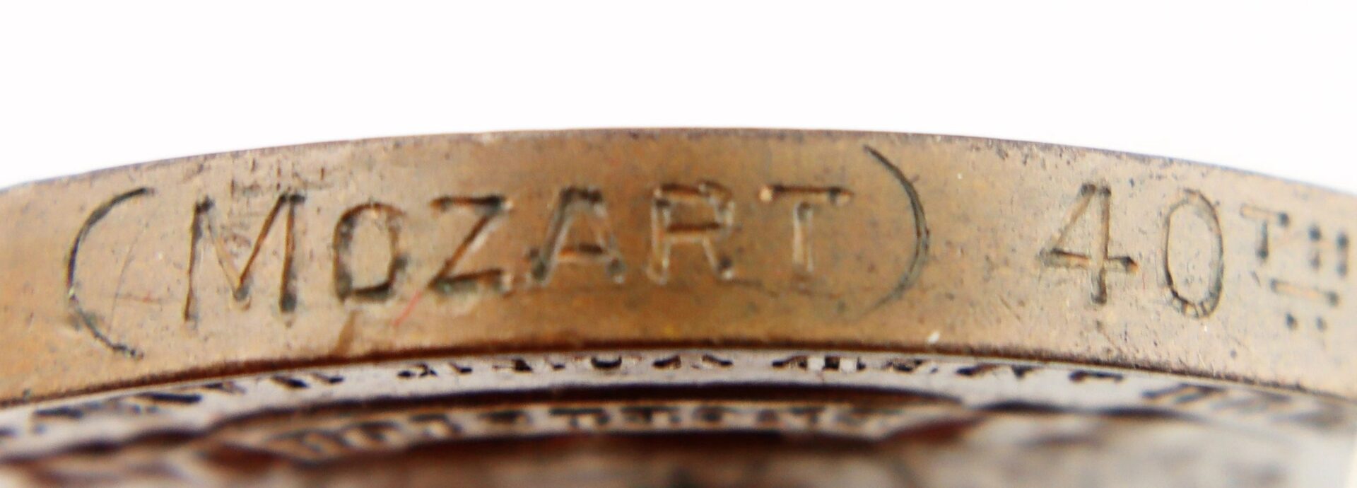 Close-up of the edge of a Gettysburg New York Day Medal inscribed to Private Hugh McDonald, 40th New York Infantry "Mozart Regiment".