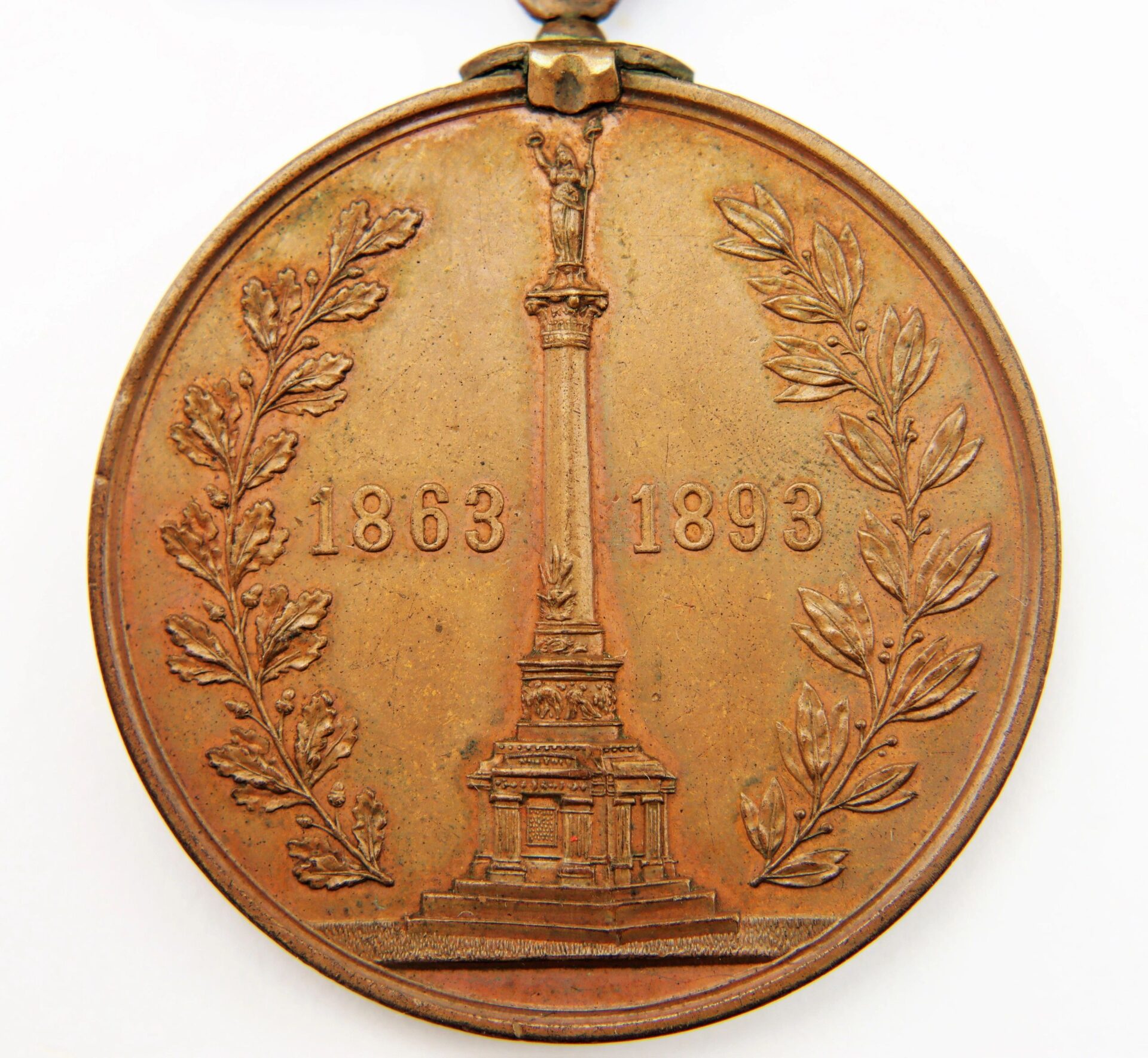 Gettysburg New York Day Medal inscribed to Private Hugh McDonald, 40th NY Infantry “Mozart Regiment”; bronze medal featuring a central monument flanked by laurel branches with "1863" and "1893" inscribed on each side.