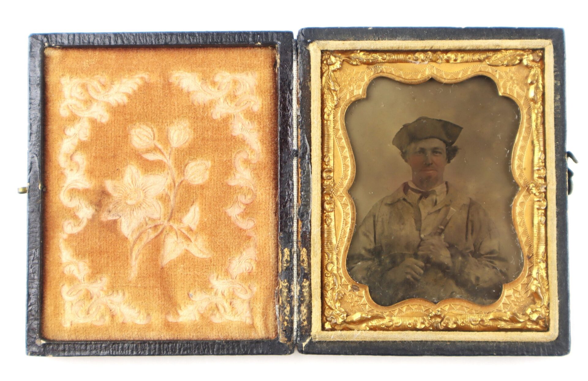 An antique daguerreotype titled "Confederate Soldier with Piccolo!" shows a man in period clothing, displayed in an open ornate case with gold trim and floral-patterned fabric lining.