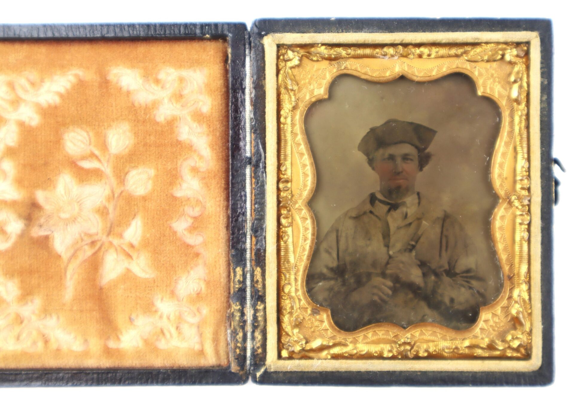 A cased old photograph titled "Confederate Soldier with Piccolo!" shows a man in historical uniform and cap, with a floral fabric pattern lining the inside cover.
