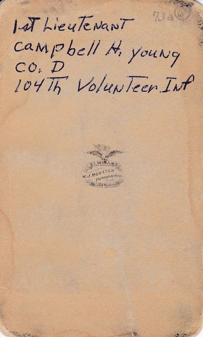 A handwritten note for Campbell H. Young, Co. D 104th Vol Infantry, appears on aged paper with a faded central emblem.