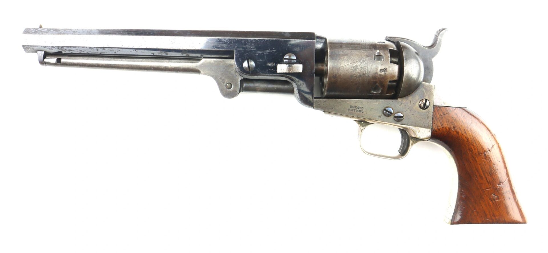 A Cased High Condition London Colt 1851 Navy Percussion Revolver with a wooden grip, metal barrel, and cylinder is displayed in side view against a white background.