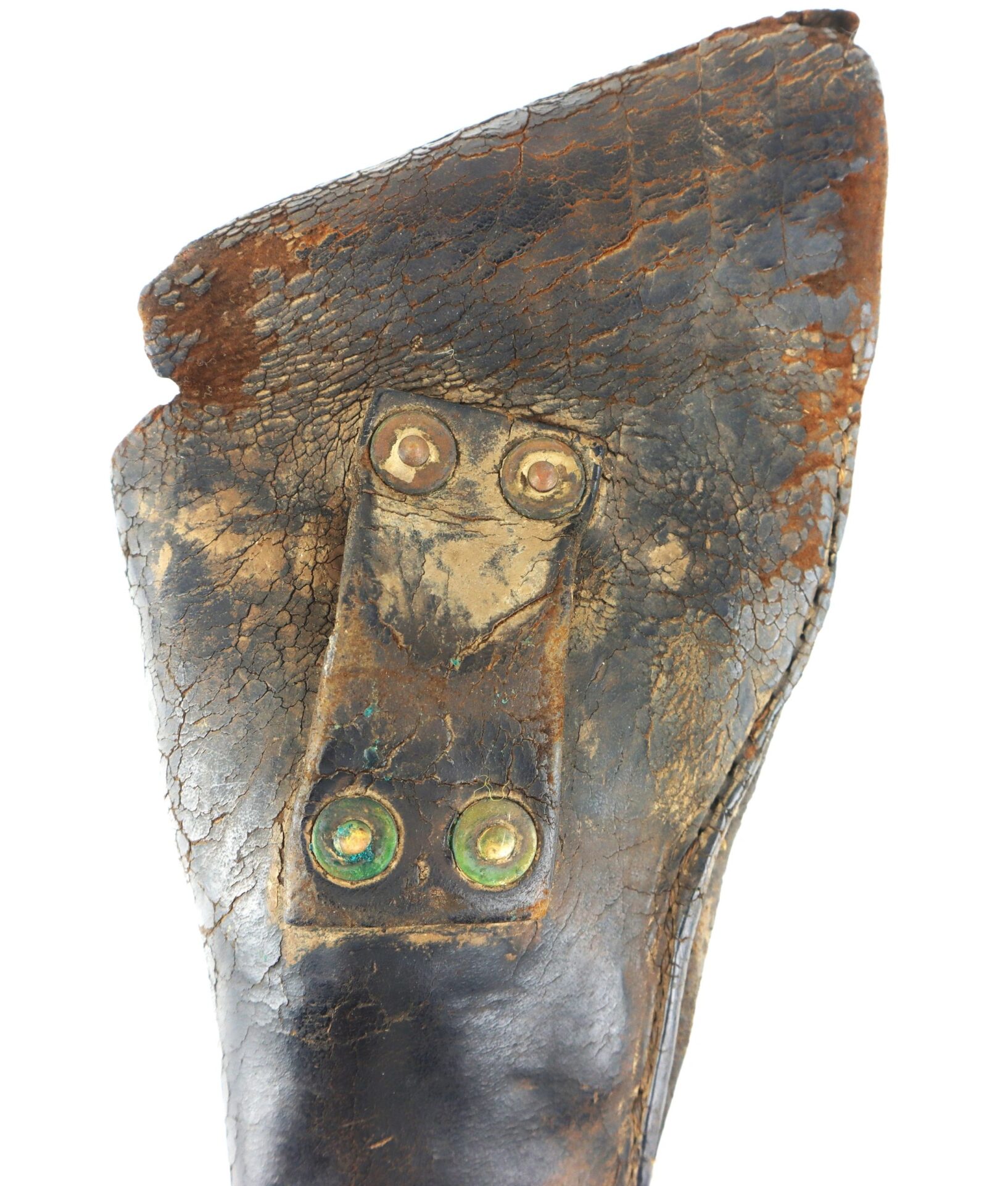 Close-up of a worn, cracked Confederate Holster with two pairs of metal rivets securing a patch.