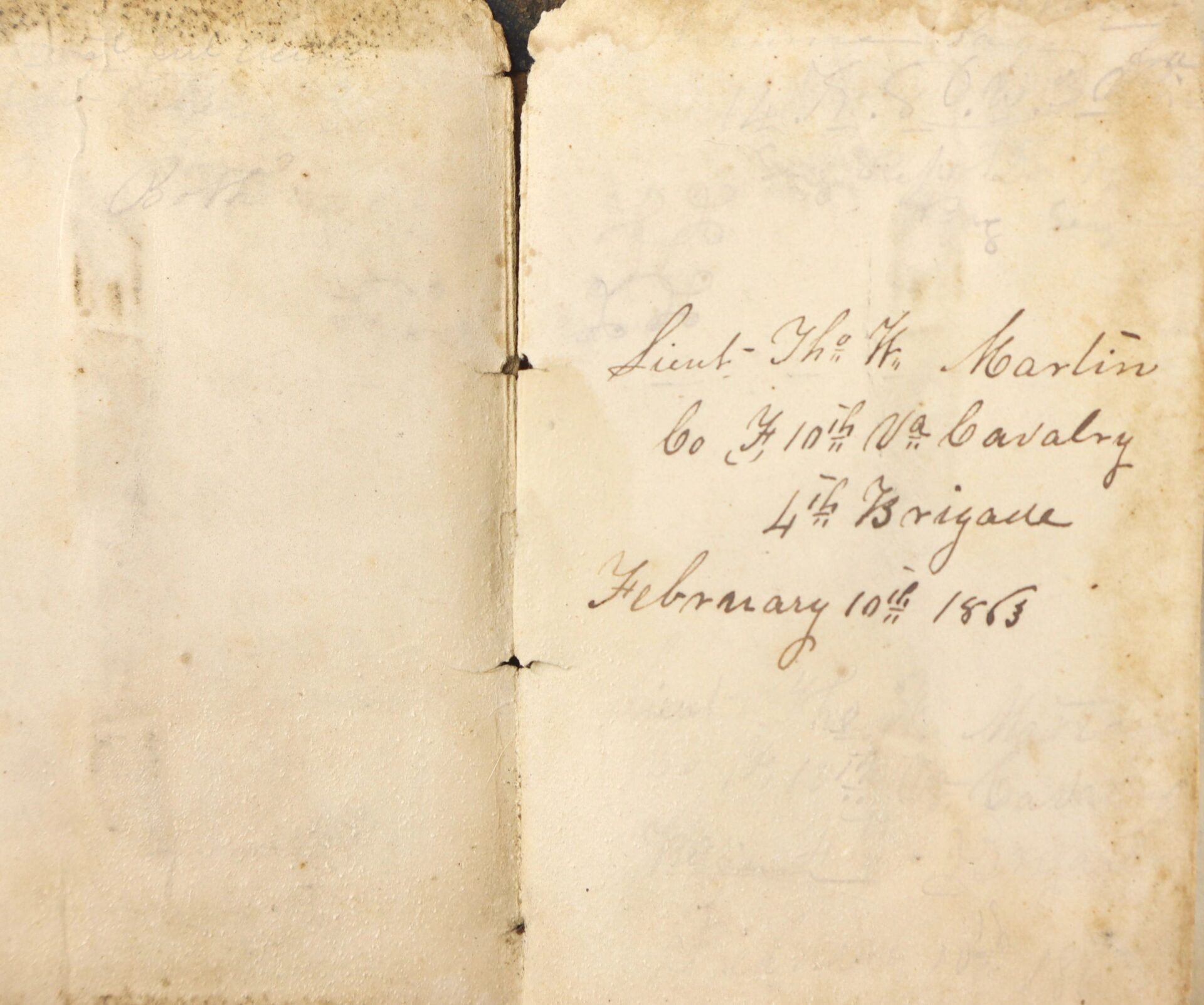 Aged, yellowed note reads: "Lieut. Tho. W. Martin, Co. H, 10th VA Cavalry, 4th Brigade, February 10th, 1863," as found in the Confederate Officer’s Ledger (SOLD).