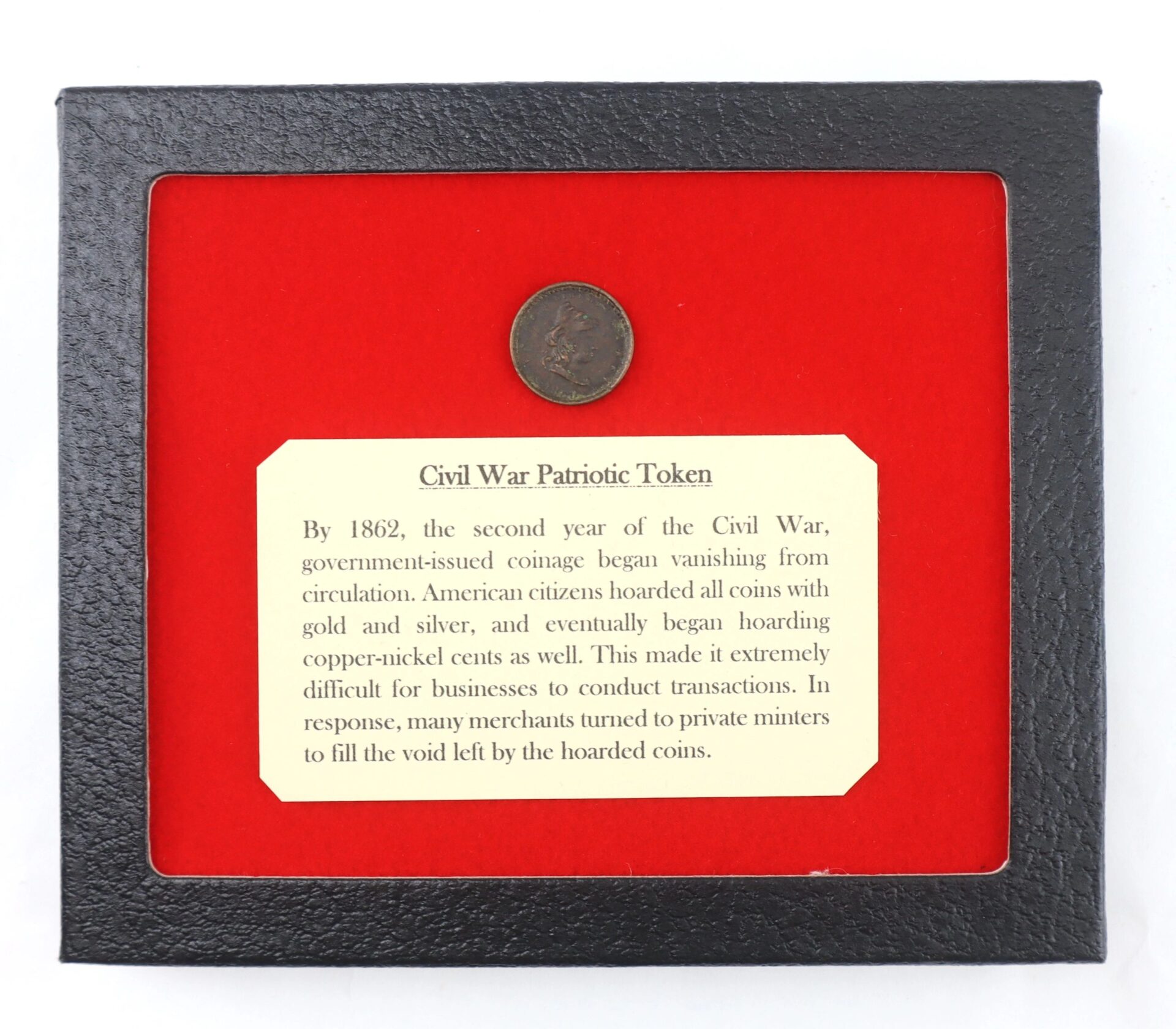 The Civil War Patriotic Token is showcased above an informational card detailing its history, all presented in a black frame with a red background.