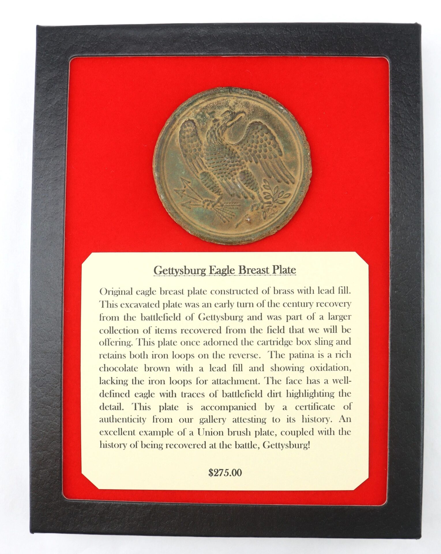 Gettysburg Eagle Breast Plate / SOLD – Brass plate with description card on Civil War origins, framed in black with red background. $275.00.