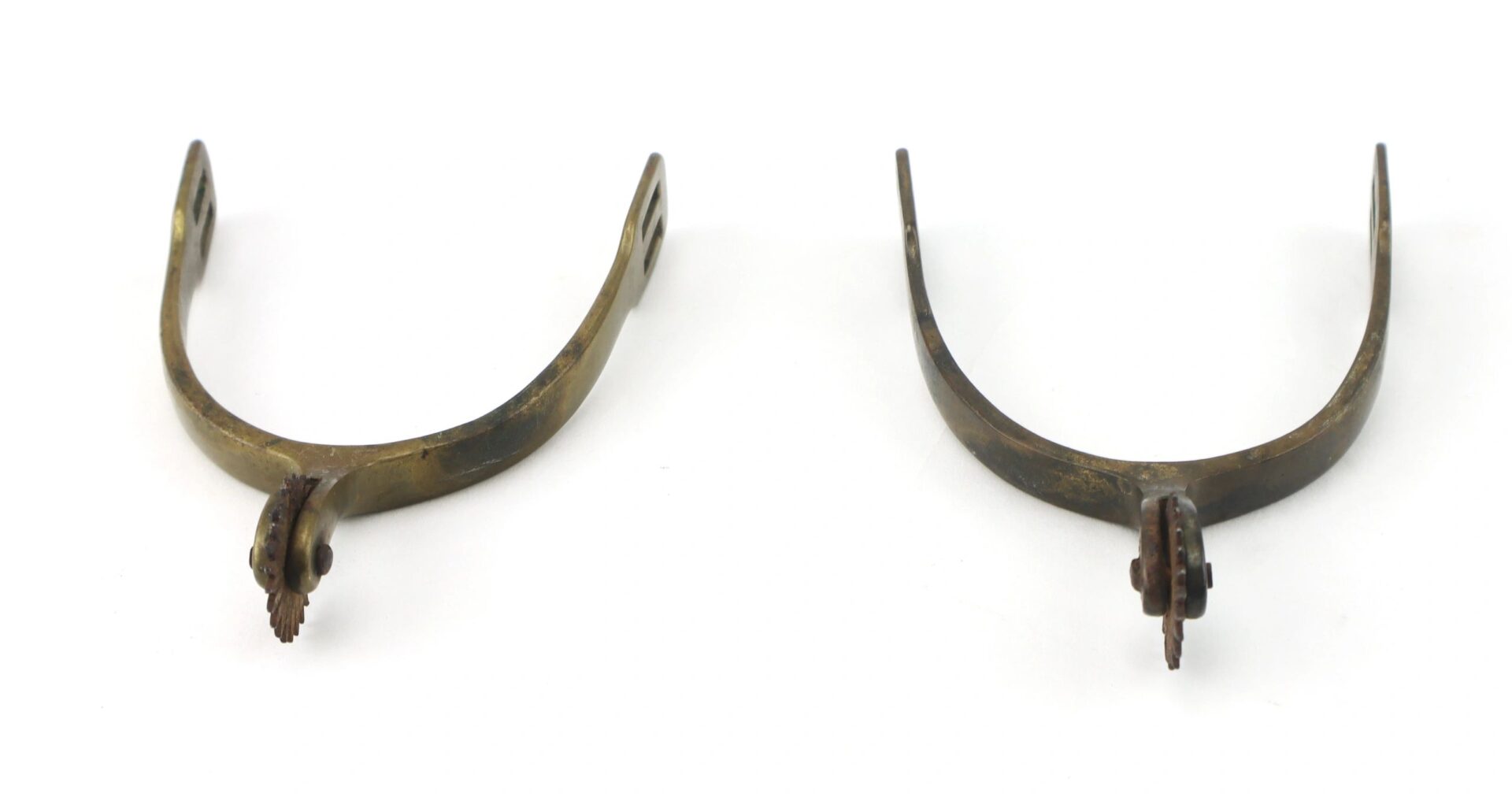 A pair of Civil War Spurs with rowels, positioned side by side on a white background.