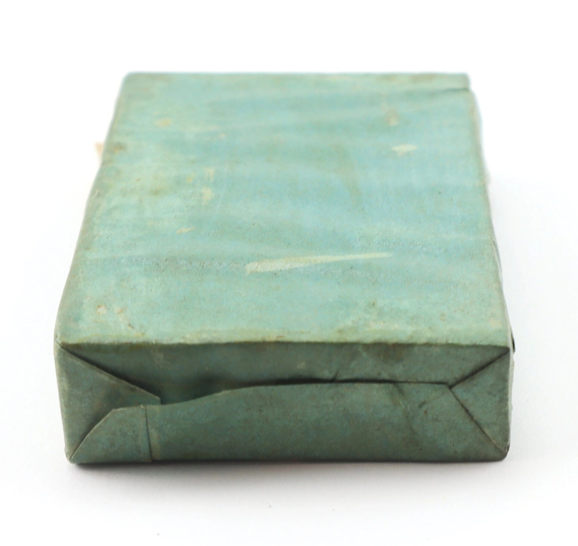A worn, rectangular package of Frankford Arsenal 12 Second Fuses wrapped in faded light blue-green paper with visible creases.