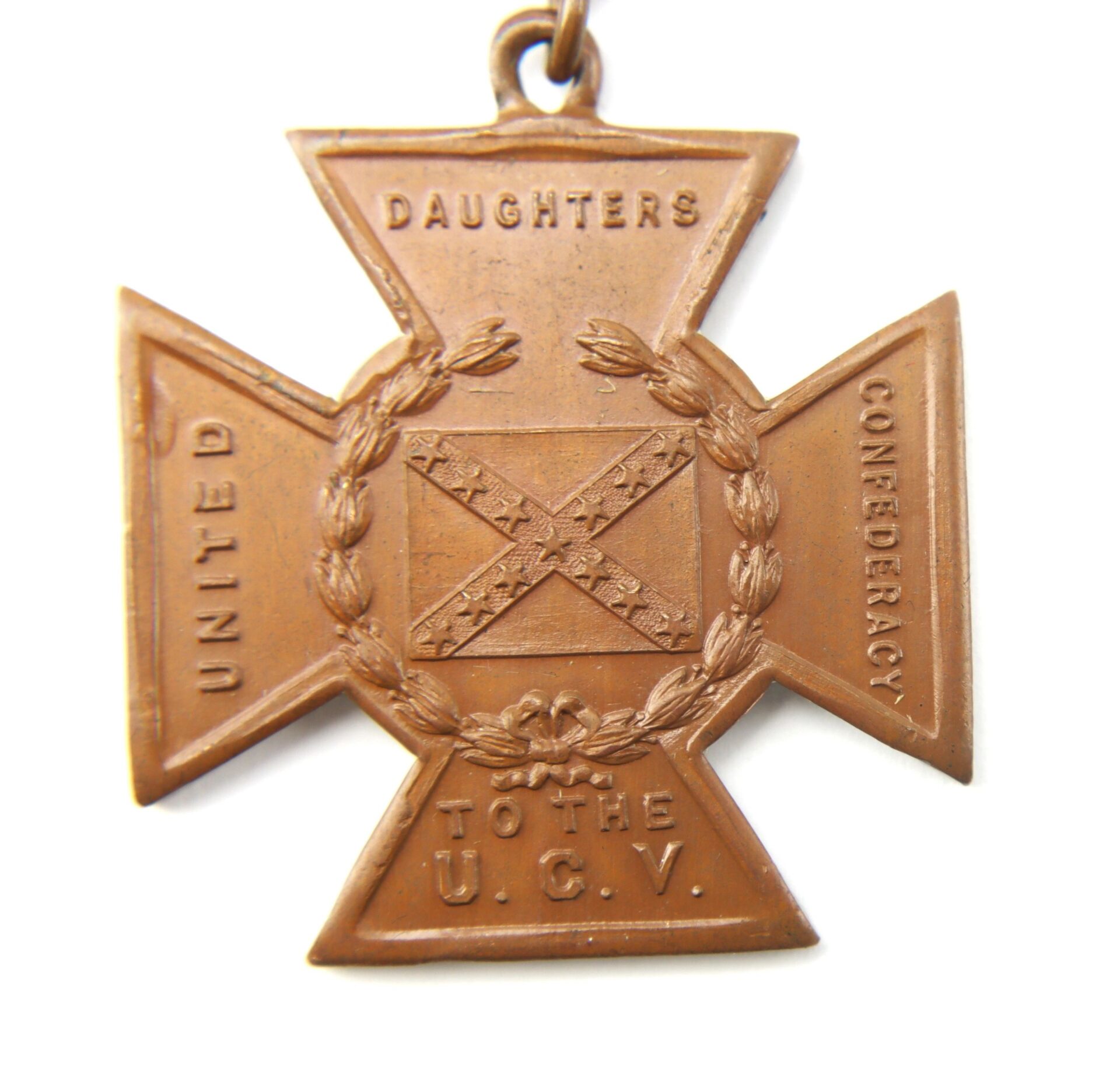 Bronze cross-shaped Southern Cross of Honor medal with laurel wreath and Confederate battle flag, inscribed "United Daughters Confederacy to the U.C.V.," awarded to twice-wounded Captain J.A.W. Thomas, Co. F, 21st South Carolina Infantry.