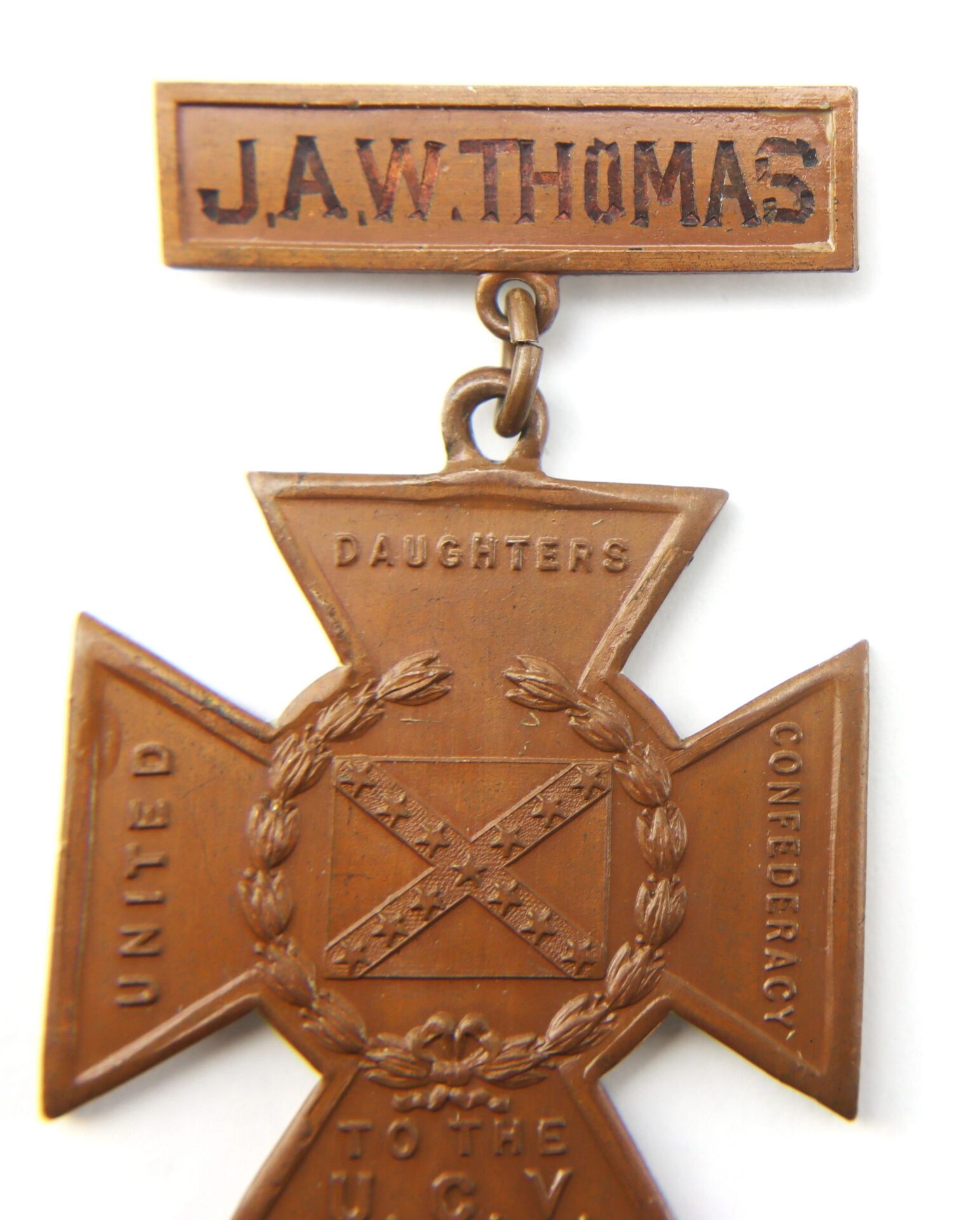 The Southern Cross of Honor, a cross-shaped bronze medal with laurel wreath and “DAUGHTERS CONFEDERACY UNITED TO THE U.C.V.” inscription, features a name bar for J.A.W. Thomas, Captain in Co. F, 21st South Carolina Infantry.