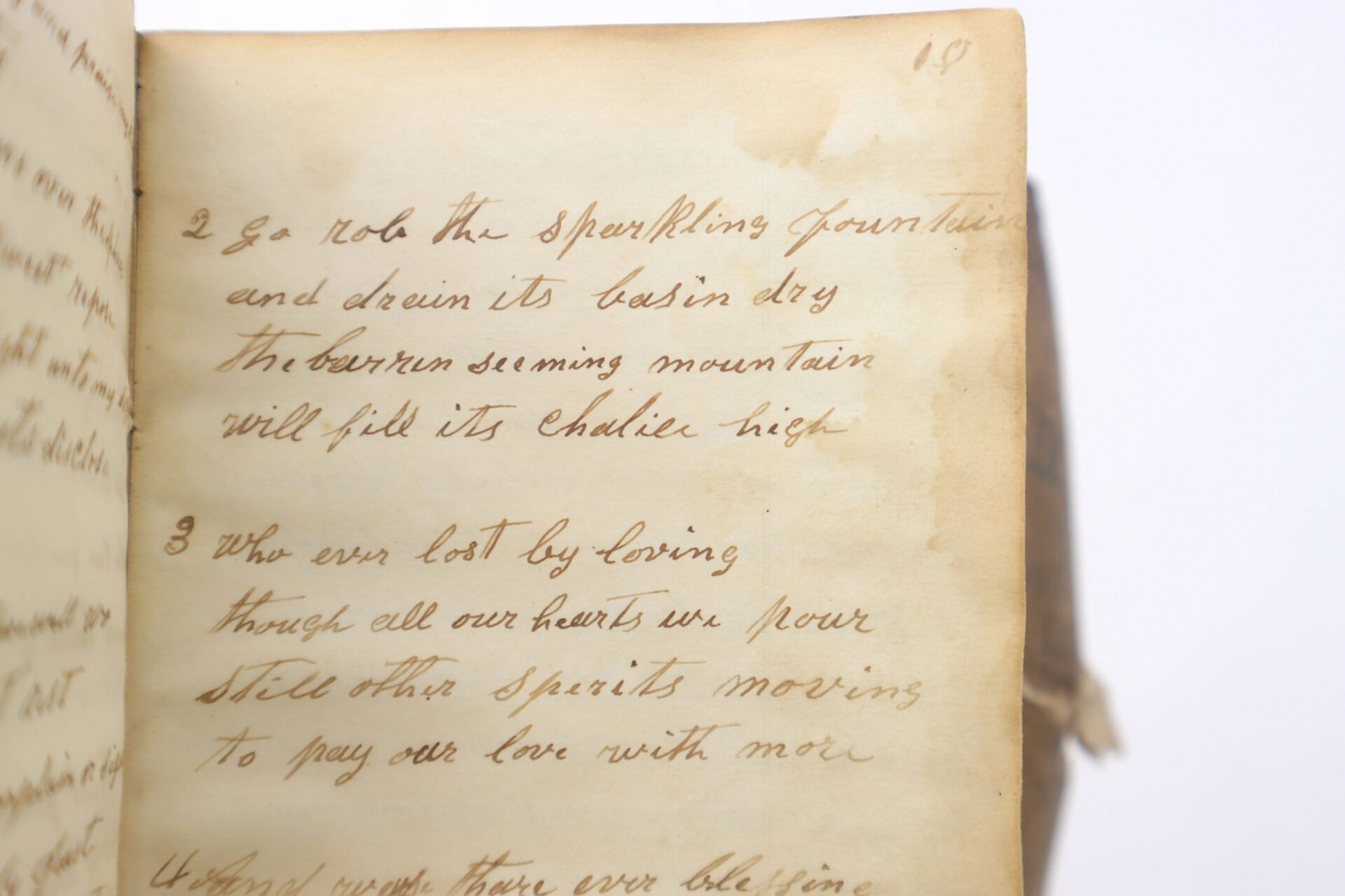 Aged paper with faded brown ink text and stanza numbers in cursive appears on the right-hand page—a handwritten poem from the 10th Tennessee Volunteer Infantry (Union) Grouping.