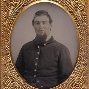 Union Private Sixth Plate Tintype featuring a bearded man in a dark buttoned coat, set in an ornate gold oval frame and captured in an old-fashioned photographic style.