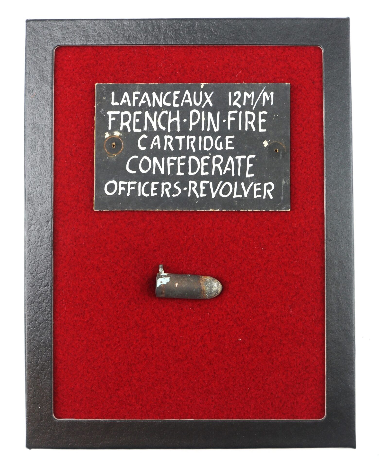 The Confederate Lafanceaux 12M/M French Pin Fire Cartridge, once used by a Confederate officer, is displayed on red fabric with an informative plaque above it.