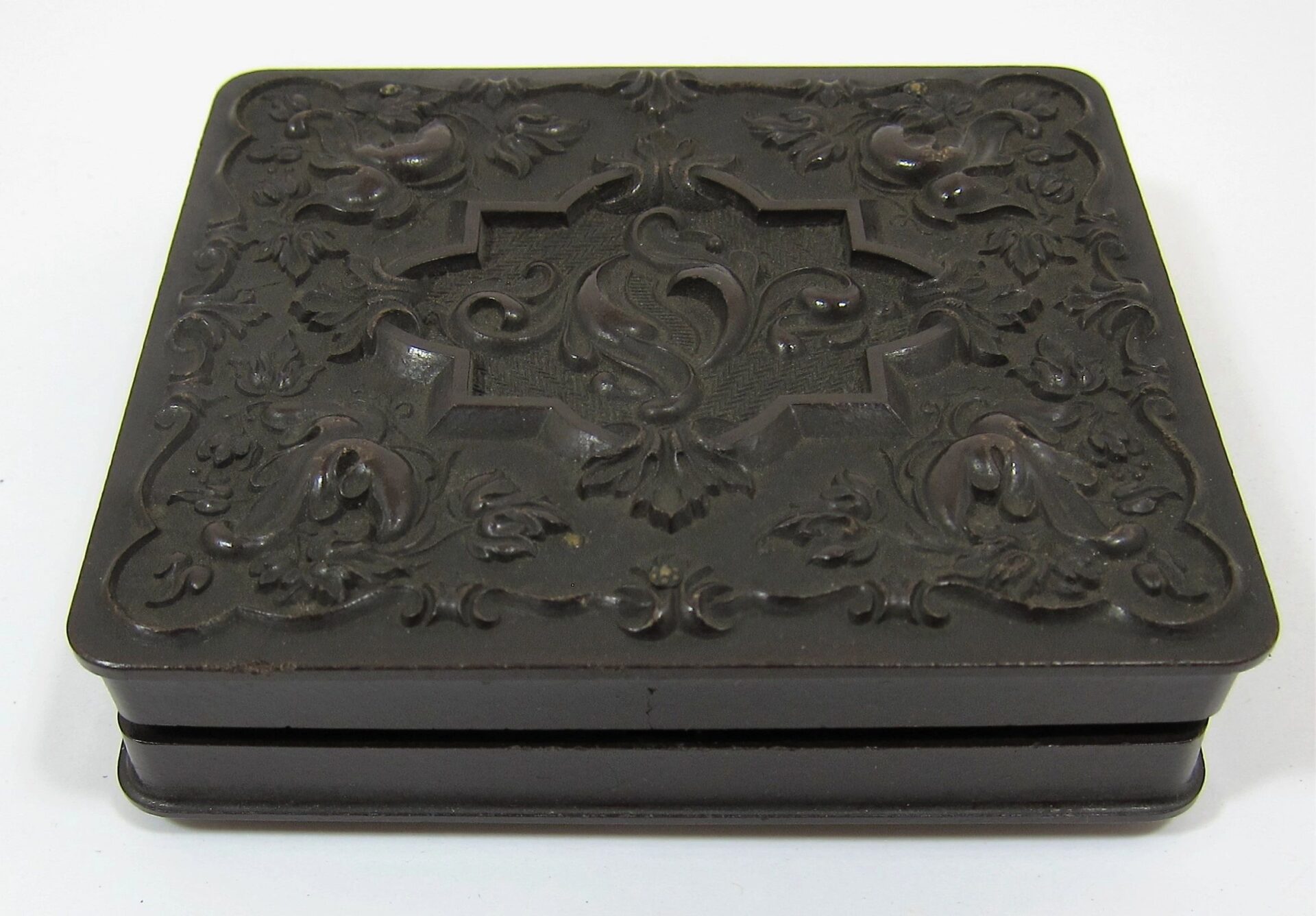 A sixth plate tintype titled "Infantry Officer Holding Musket" features an ornate, dark square box with raised floral and bird patterns on the lid, set against a plain white background.