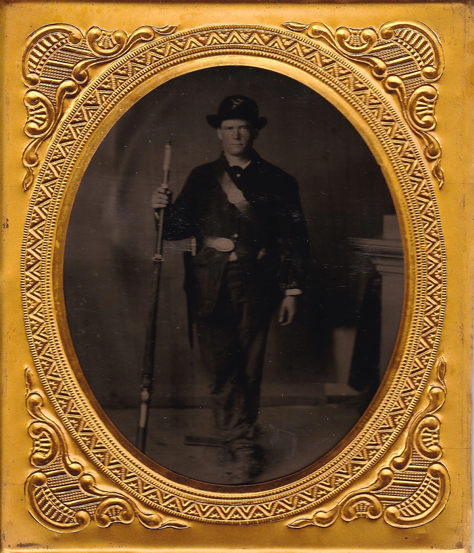 Sixth plate tintype of a 2nd Infantry Regiment Company "I" soldier in 19th-century military uniform with rifle, framed in an ornate gold oval border.