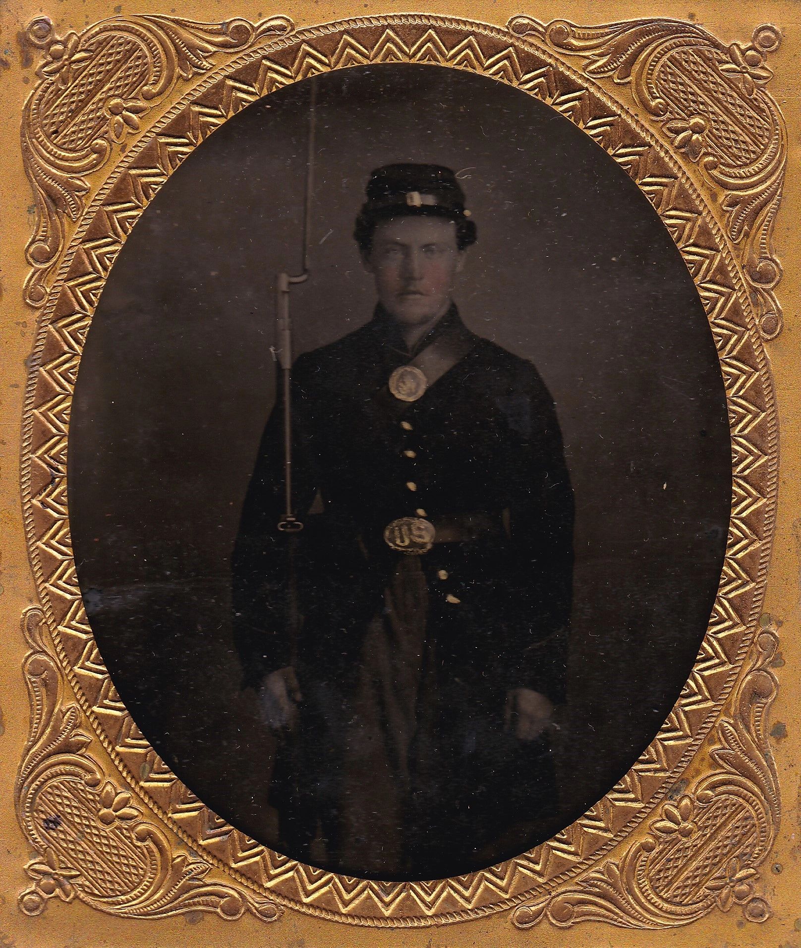 Sepia-toned portrait titled "Soldier with Model 1816 Musket Sixth Plate Tintype" shows a Civil War-era soldier in uniform holding a rifle, framed in an ornate gold-colored oval frame.