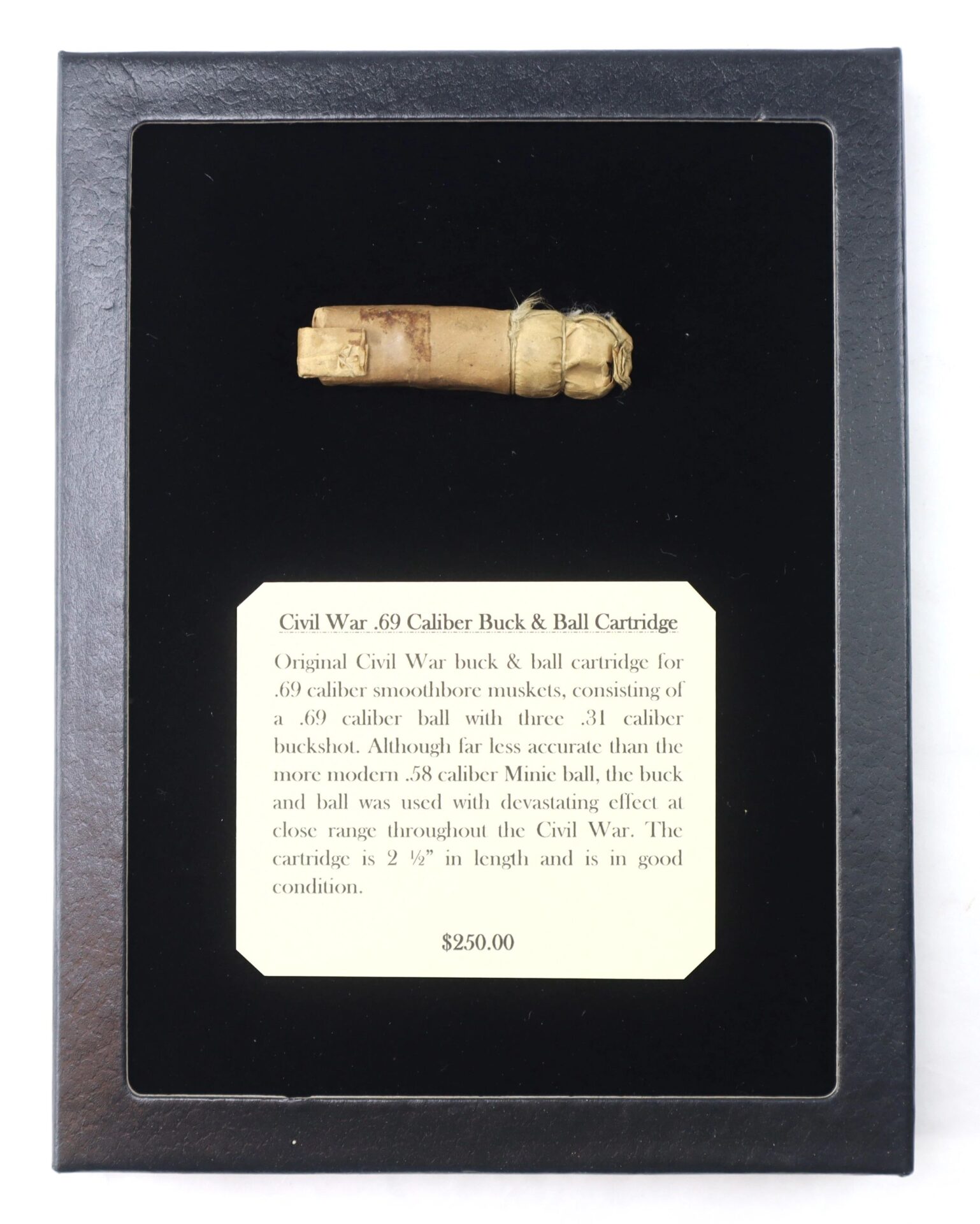 Civil War .69 Caliber Buck & Ball Cartridge displayed on black velvet with an informational card explaining its use. Priced at $250.00.