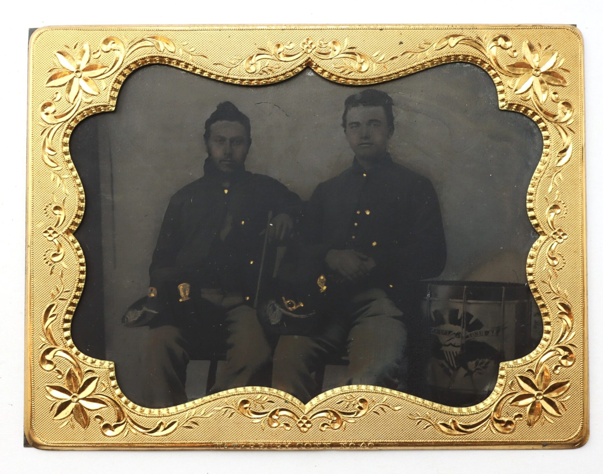 The 1/4 Plate Tintype shows two Union musicians in Hardee hats, seated side by side—one holding a sword, the other resting his hand on a drum—framed by an ornate gold border.