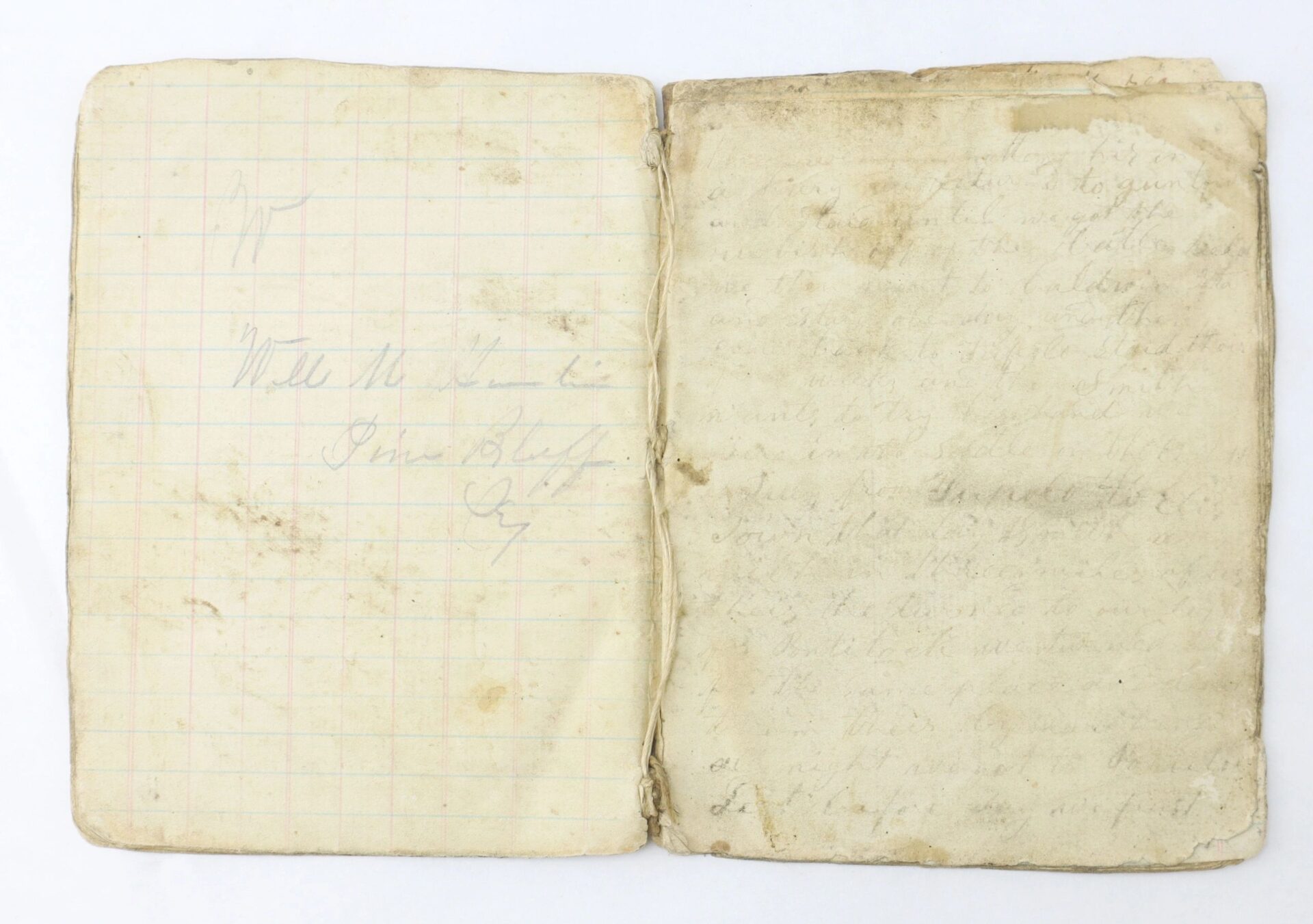 An old, worn "Diary and Record of Service of a Confederate Soldier 3rd Kentucky and 22nd Tennessee Regiment / SOLD" is open; the left page shows faint writing on a grid, while the right page is heavily faded.