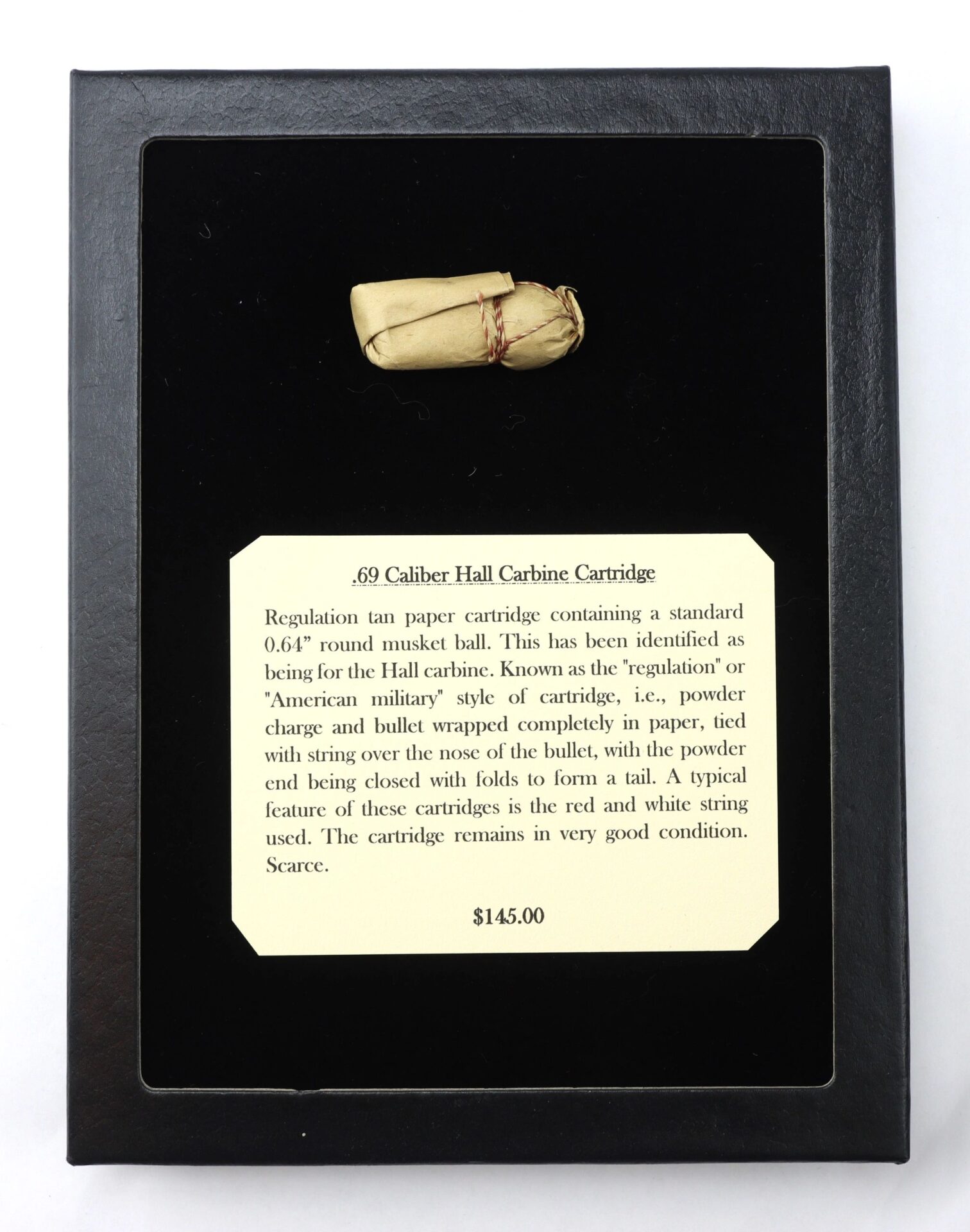 A .69 Caliber Hall Carbine Cartridge wrapped in tan paper is shown above a plaque describing it as a rare, well-preserved musket ball cartridge, with a price of $145.00.