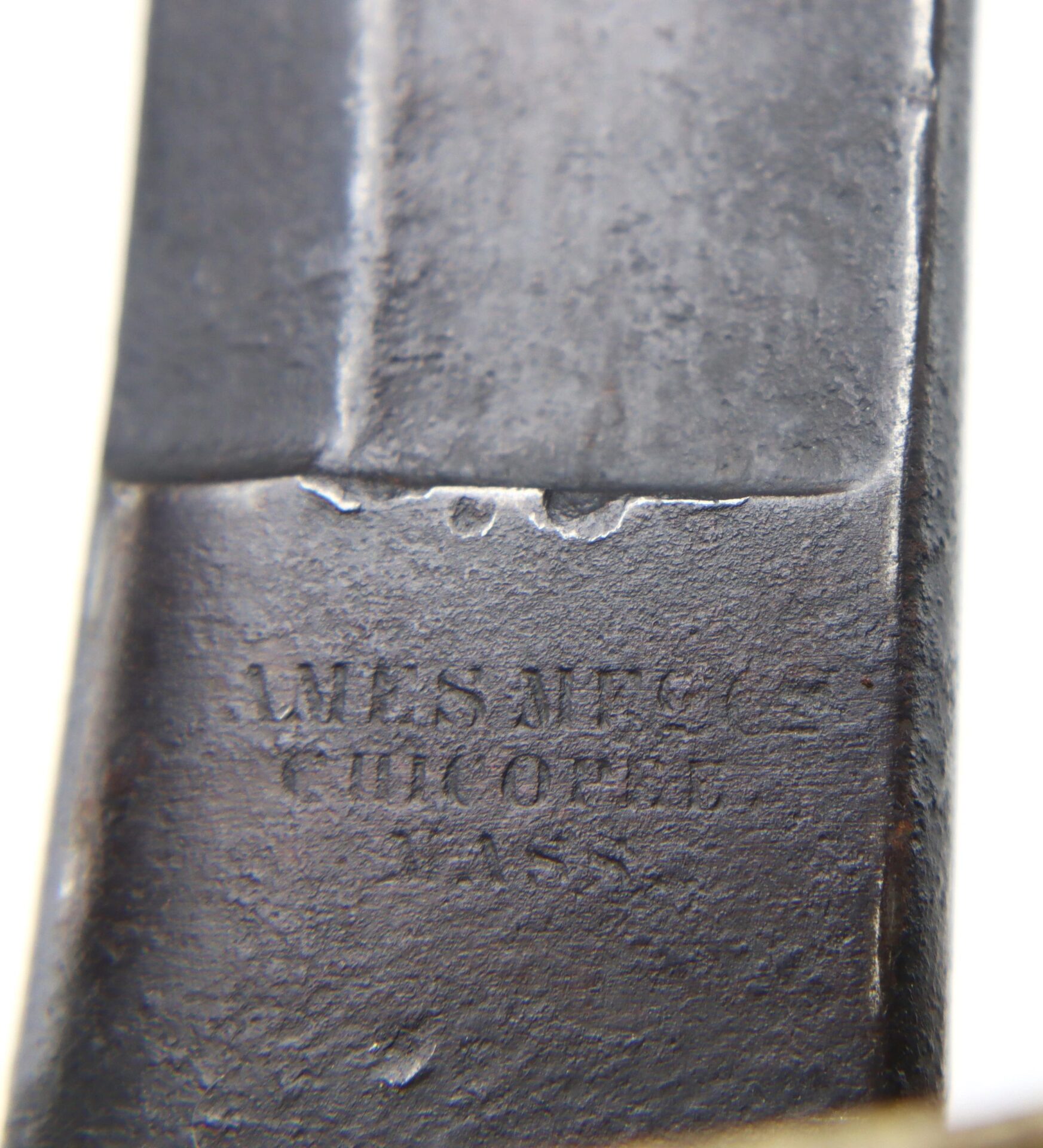 Close-up of a metal surface stamped with "AMES MFG CO CHICOPEE MASS" on a Gettysburg Cavalry Saber / SOLD.