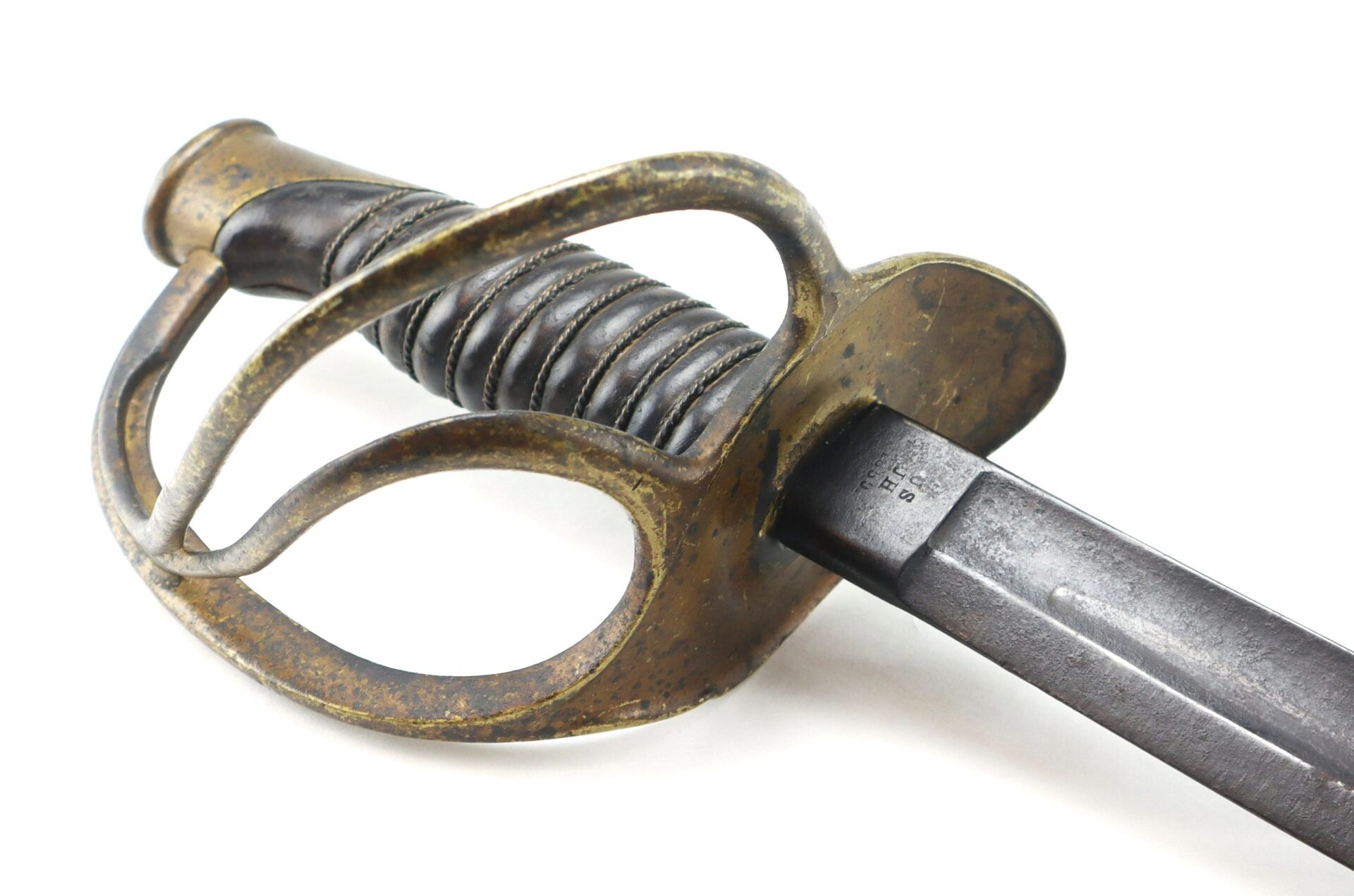 Close-up of the Gettysburg Cavalry Saber, featuring a curved handguard and ribbed grip with visible signs of age and rust. / SOLD.