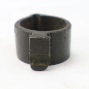 A close-up photo of the Boyle, Gamble, & McFee Bayonet Adapter, a small cylindrical dark metal or plastic ring with a flat tab extending from one side.