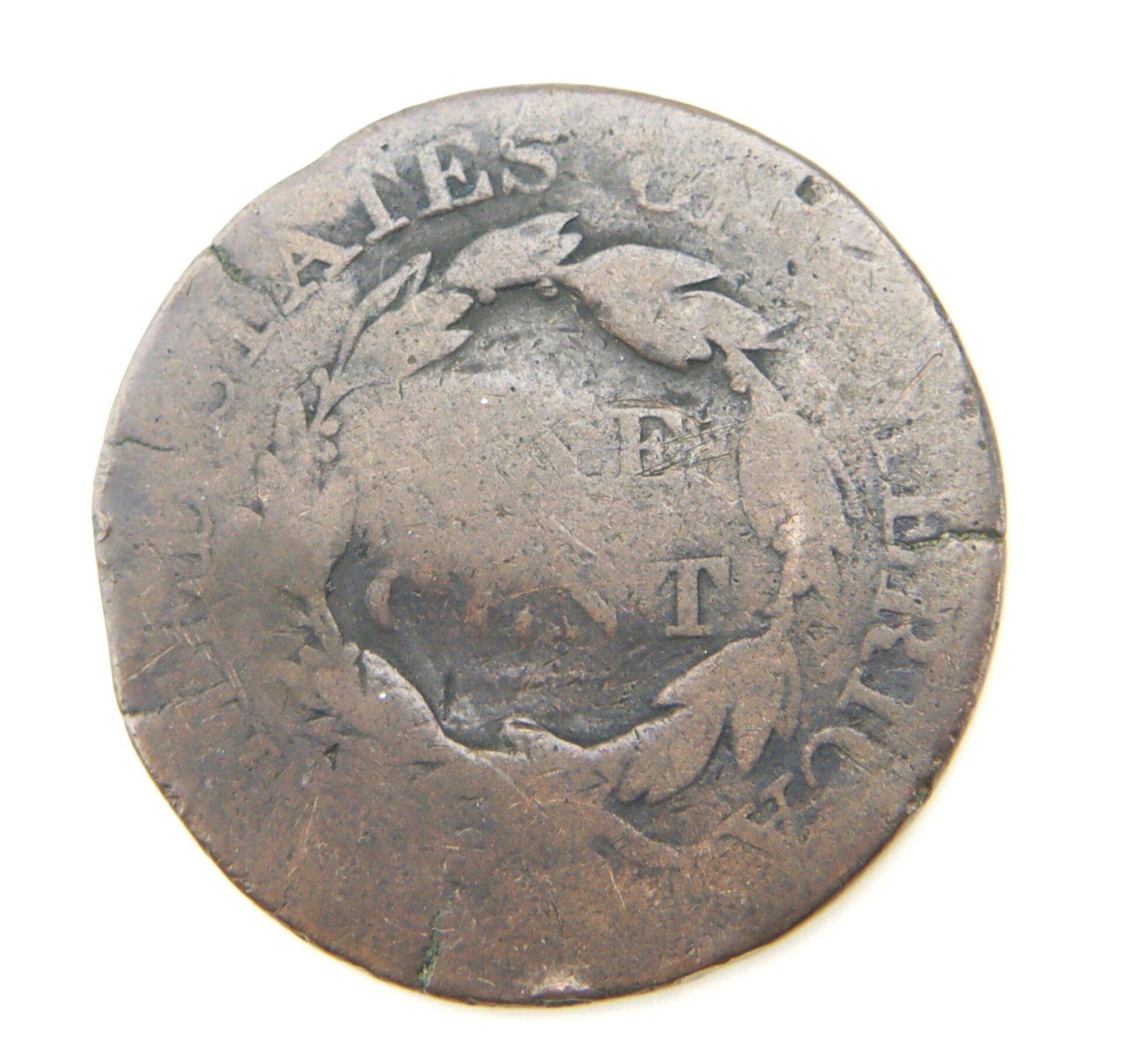 Worn Vote the Land of the Free Kansas Statehood Token, showing "STATES OF AMERICA" around the edge, a center wreath, and partially visible letters "E" and "T".