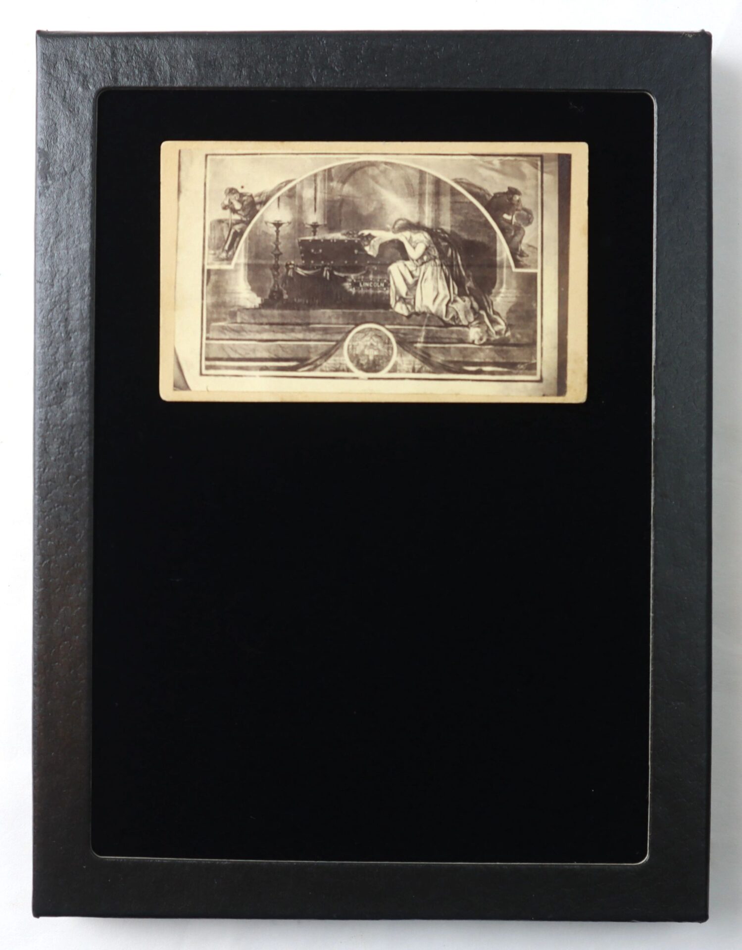 A black frame showcases the Abraham Lincoln Mourning CDV, featuring an old, sepia-toned illustration of a seated figure at an ornate table with two cherubs in the background.