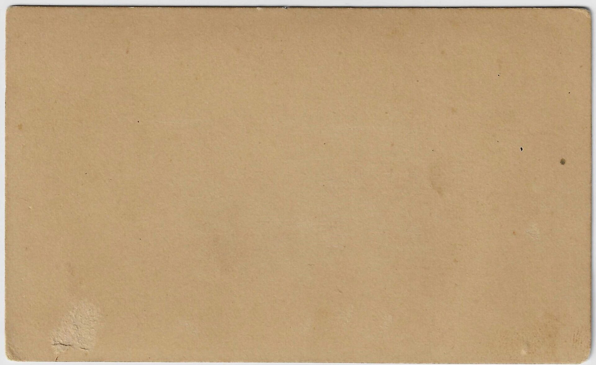 A rectangular Abraham Lincoln Mourning CDV made of light brown cardboard, featuring slightly rounded corners and minor surface marks.