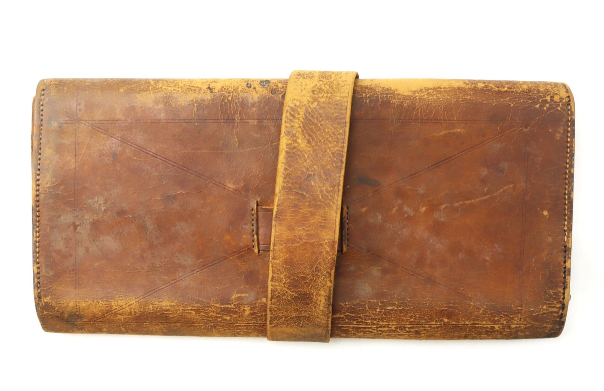 The Inscribed Wallet of Corporal David Steele, 2nd New Hampshire Infantry, is a worn brown leather roll-up pouch with a wide strap, shown on a white background.