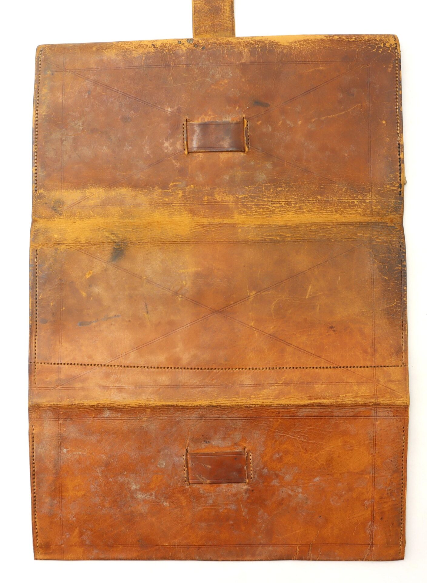 The Inscribed Wallet of Corporal David Steele, 2nd New Hampshire Infantry / ON-HOLD, is a worn brown leather case, open to reveal two rectangular pockets, visible stitching, scratches, and signs of use.