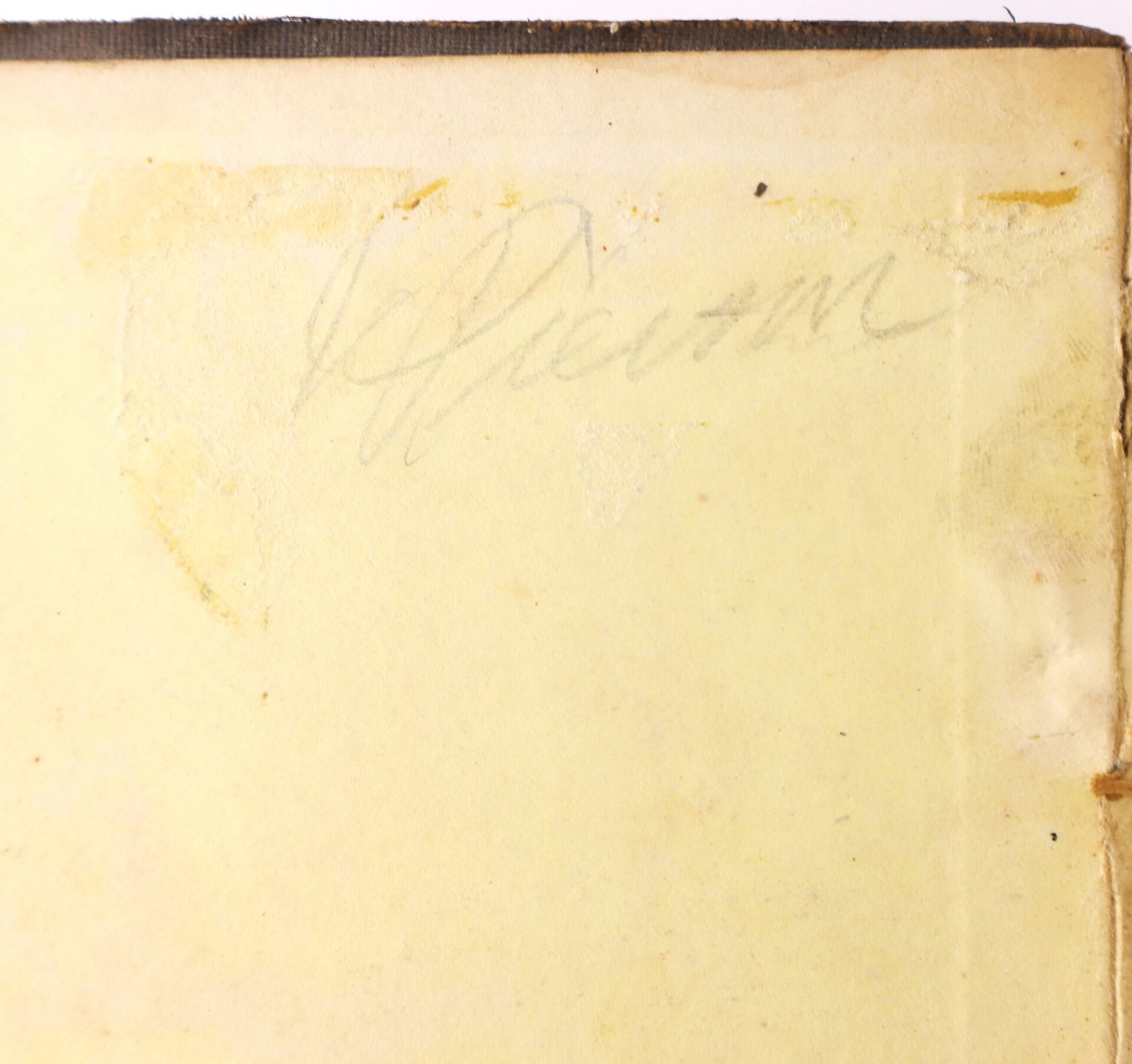 A faded pencil signature appears on a yellowed, aged page from "Fifty Years in Chains, The Life of an American Slave," with adhesive residue visible in the upper left corner.
