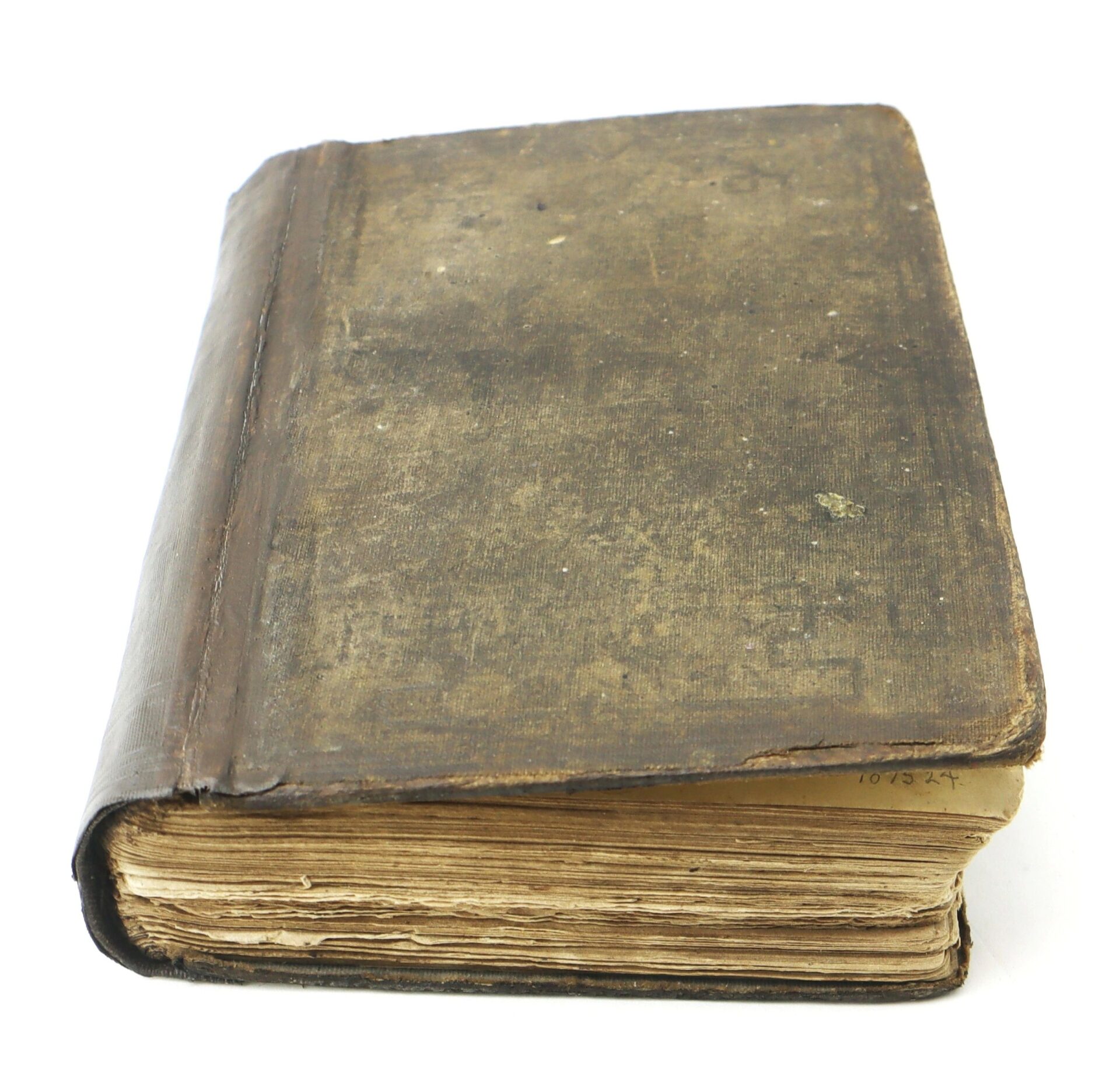 A closed copy of "Fifty Years in Chains, The Life of an American Slave" with a worn dark brown cover and yellowed pages lies on a white background.
