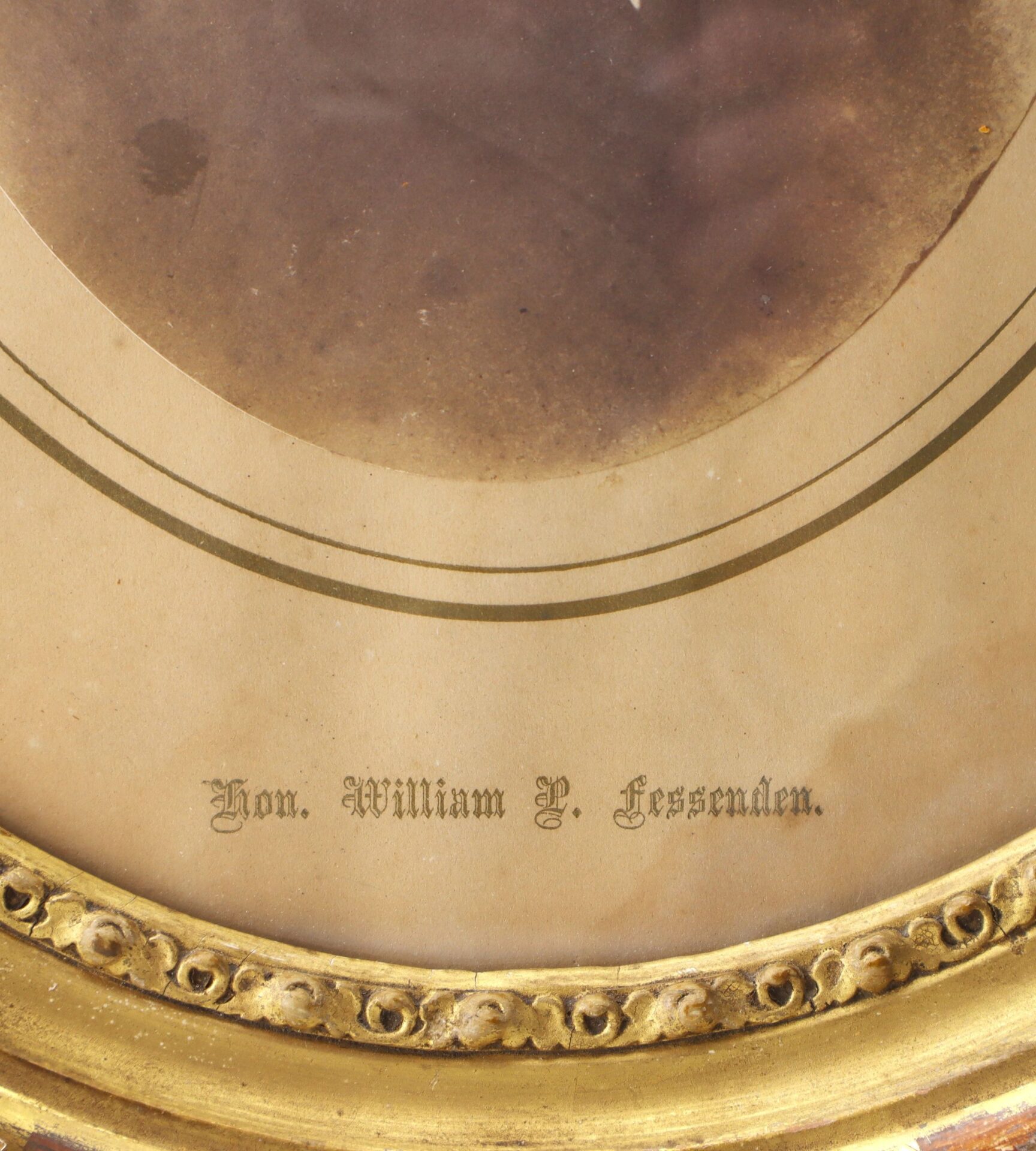 A sepia-toned photo in a gold ornate frame features "William P. Fessenden" labeled in decorative script on the mat.