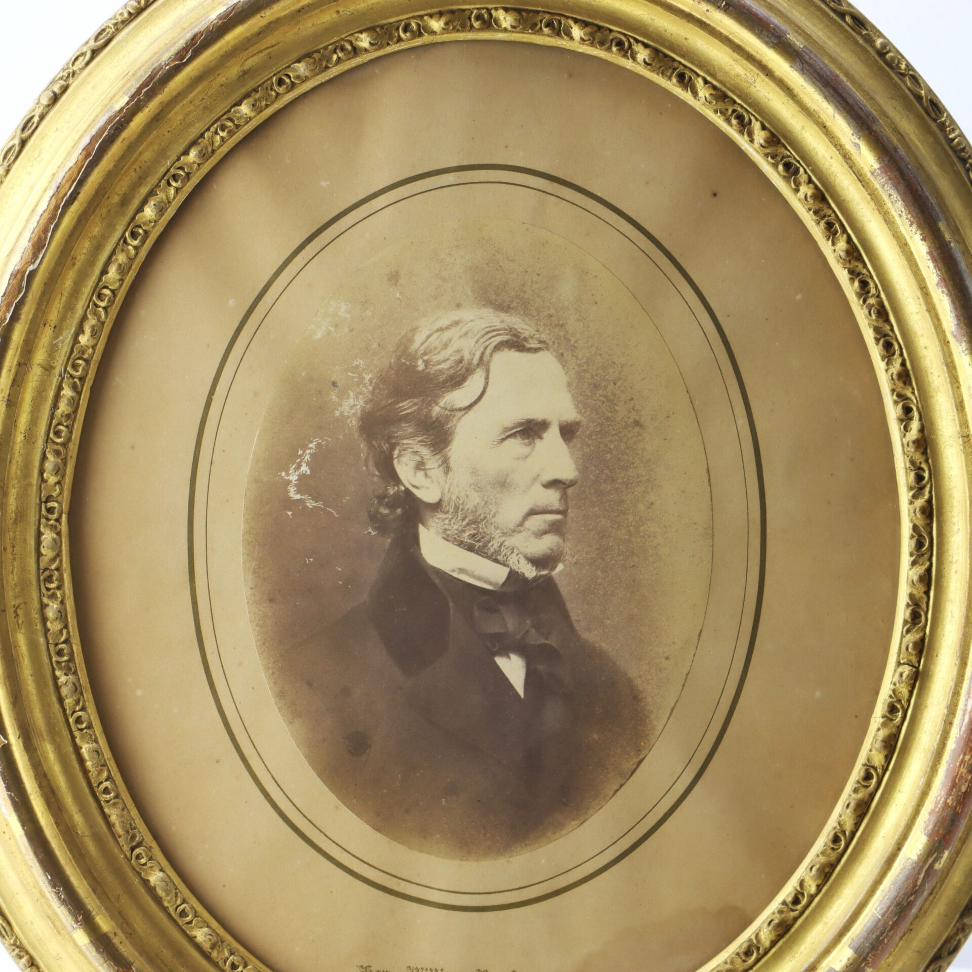 Sepia-toned portrait of William P. Fessenden, a bearded man in 19th-century formal attire, displayed in an ornate oval gold frame.
