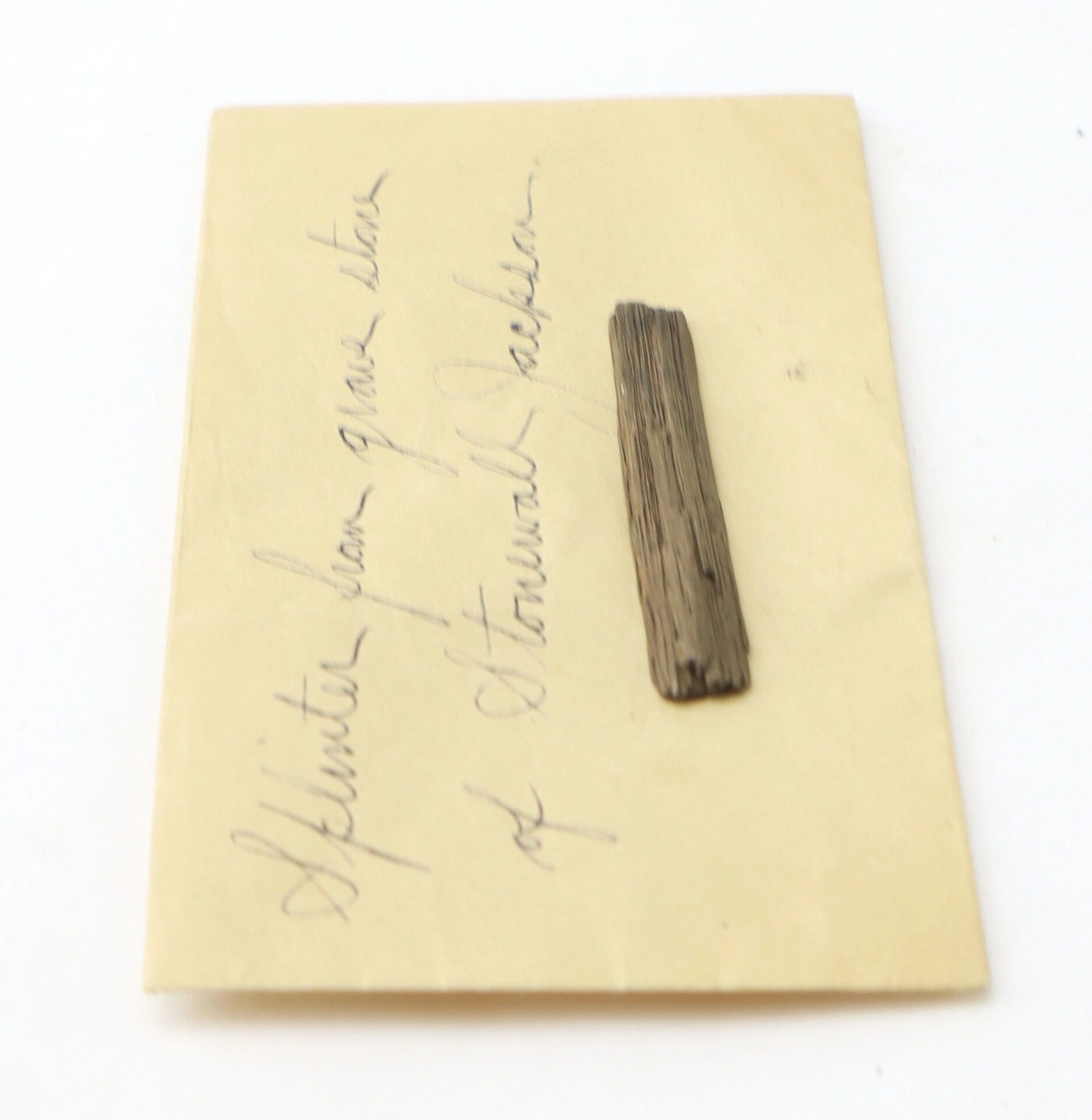 A Splinter from the Grave of Stonewall Jackson rests atop a handwritten note in cursive on yellowed paper.