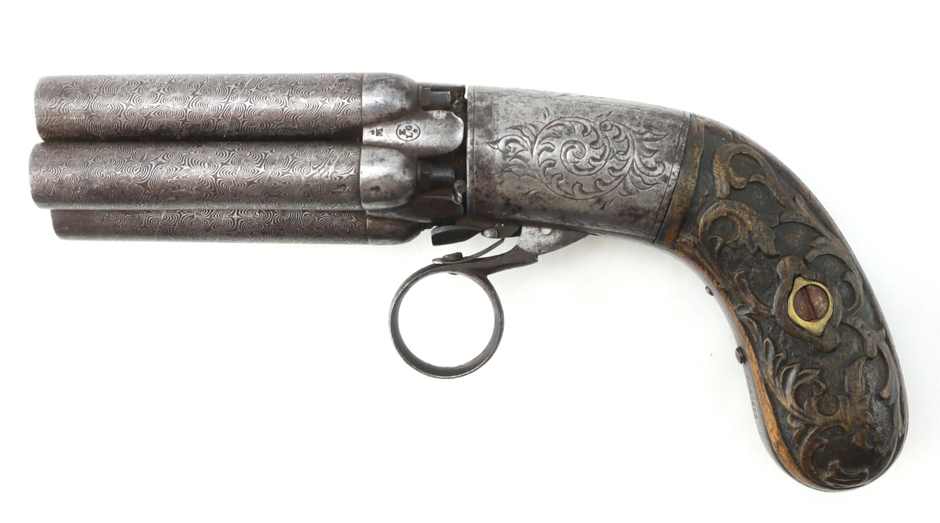 A five-barrel pepperbox revolver with ornate engravings on the metal and wooden handle, displayed in a side view against a white background.