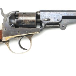 The Cooper Double Action Revolver, featuring a wooden grip, metal trigger, and long barrel, is displayed in profile against a white background.