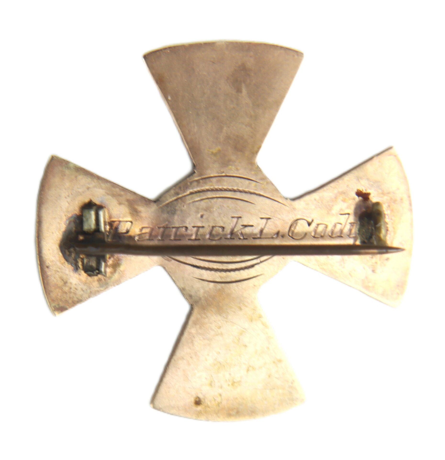 A gold identification badge for Pvt. Patrick L. Cody, Company A, 128th NY Volunteer Infantry, 19th Army Corps, Union Army (Civil War), cross-shaped with his name engraved and a horizontal pin clasp on the back.