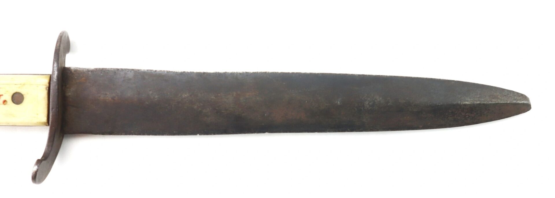A close-up of the Scrimshawed Civil War Dagger inscribed to Captain E. S. Jenney, showing its wide, dark, slightly rusted blade with a visible guard and handle.