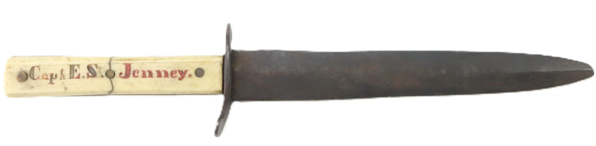 Scrimshawed Civil War Dagger inscribed to Captain E. S. Jenney, featuring a bone handle and a dark, narrow blade.