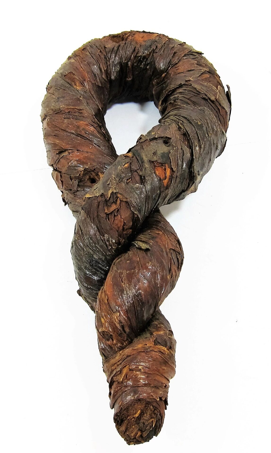A Tobacco Twist, a coiled, dried tobacco leaf shaped like a figure eight or twisted rope, is displayed against a white background. Product: Tobacco Twist / SOLD.