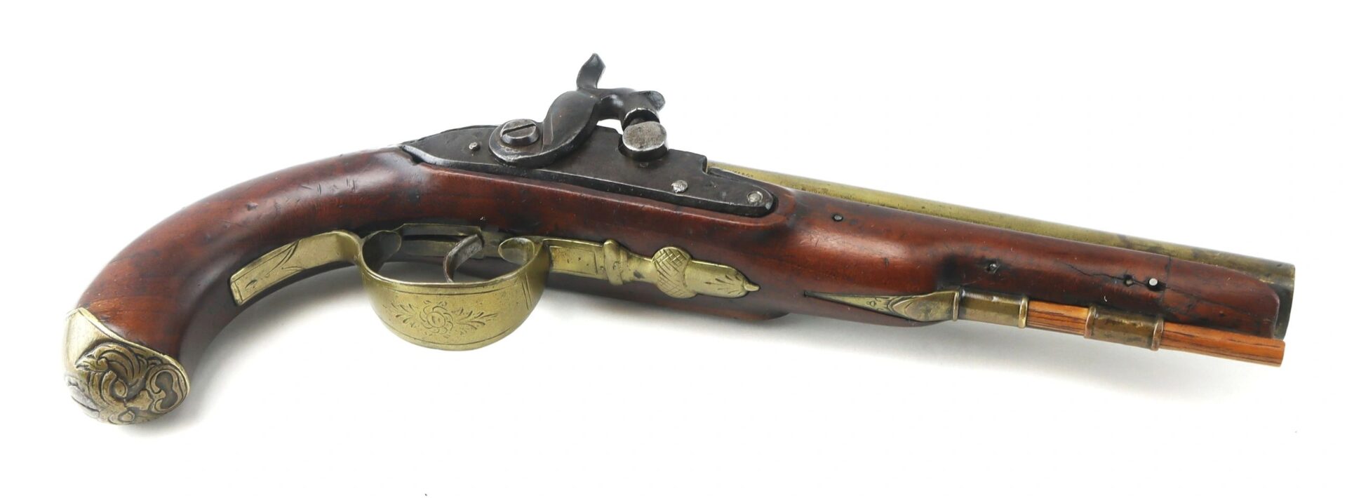 English Pistol with Brass Barrel and Grotesque Mask Butt Cap featuring a wooden handle, brass accents, and detailed metalwork, shown from the side on a white background.