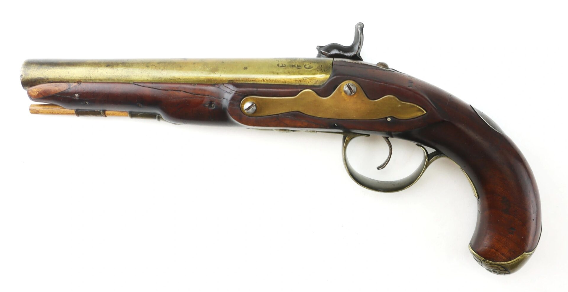 An English Pistol with Brass Barrel and Grotesque Mask Butt Cap, featuring a wooden handle, metal accents, and detailed craftsmanship.