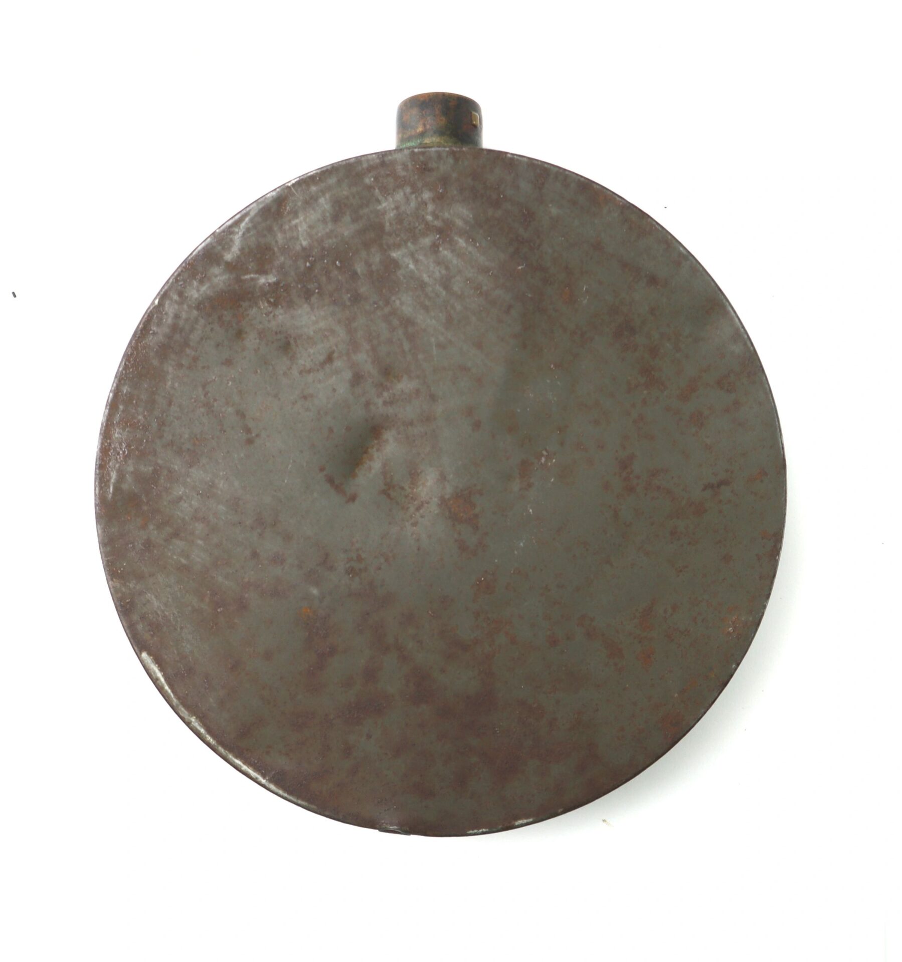A Civil War Tin Drum Canteen, round and flat with a short neck and visible rust marks, is photographed on a white background.