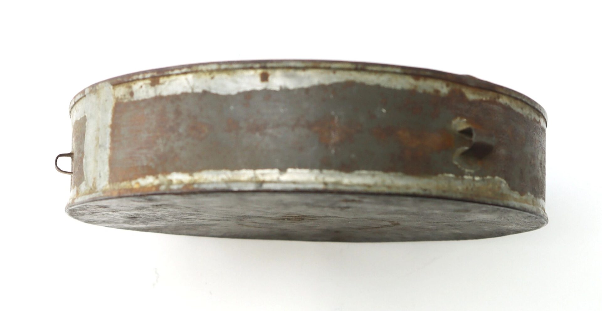A round, rusted Civil War Tin Drum Canteen with a dent and latch, shown from the side view against a white background.